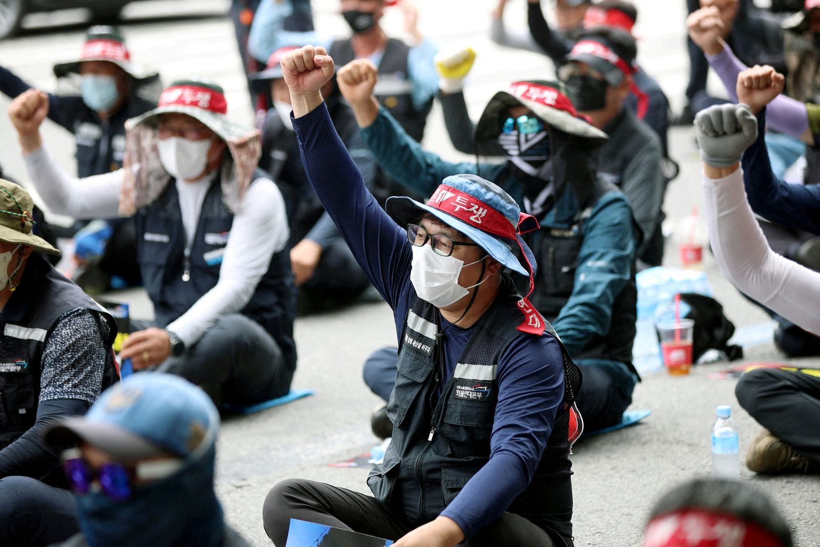 FILE PHOTO: Members of the Cargo Truckers Solidarity union take part in a protest in front of Kia Motor's factory tin Gwangju - REUTERS