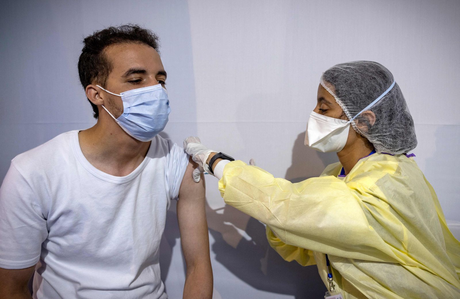 A Moroccan health worker administers a dose of the Sinopharm vaccine for Covid-19 at a vaccination centre, part of the local 