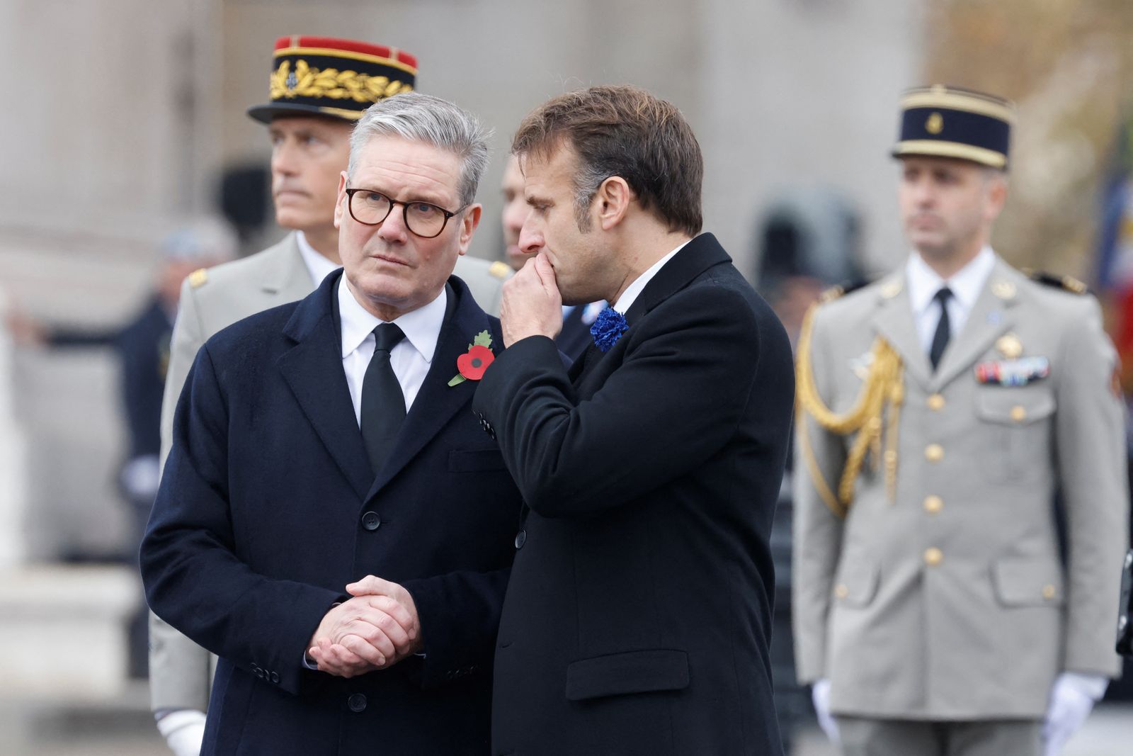 Britain's Prime Minister Keir Starmer and France's President Emmanuel Macron watch as the French Republican Guard cavalry (Garde Republicaine) parades on the Place de l'Etoile, during commemorations marking the 106th anniversary of the November 11, 1918, Armistice, ending World War I (WWI), in Paris, on November 11, 2024. LUDOVIC MARIN/Pool via REUTERS