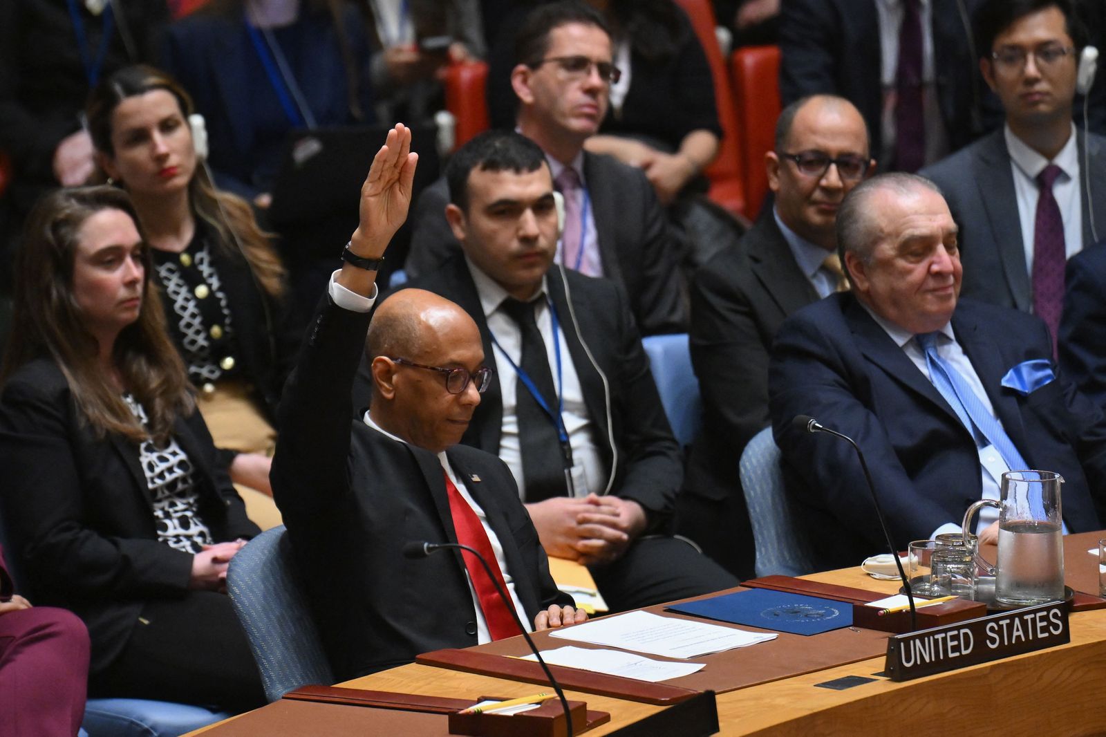 US Deputy Ambassador to the UN Robert Wood votes against a resolution allowing Palestinian UN membership at United Nations headquarters in New York, on April 18, 2024, during a United Nations Security Council meeting on the situation in the Middle East, including the Palestinian question. The United States vetoed a Security Council measure on a Palestinian bid for full United Nations membership. The draft resolution, which was introduced by Algeria and 'recommends to the General Assembly that the State of Palestine be admitted to membership of the United Nations,' received 12 votes in favor, two abstentions and one against. (Photo by ANGELA WEISS / AFP)