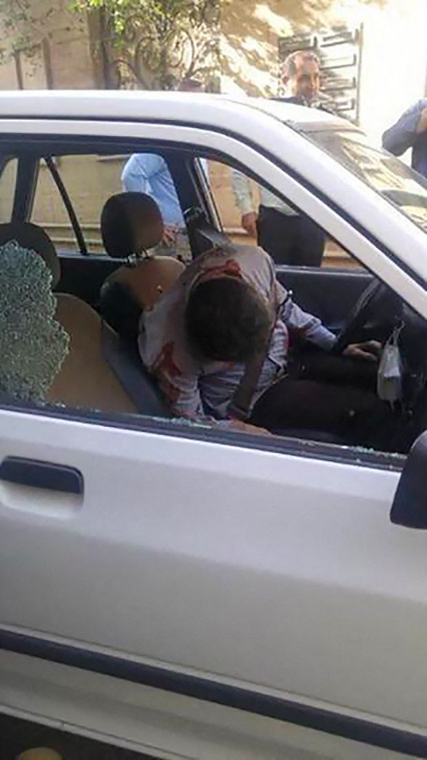 EDITORS NOTE: Graphic content / A picture shows the body of Iranian Revolutionary Guards colonel Sayyad Khodai, after he was shot dead, in his car in the Iranian capital Tehran on May 22, 2022. - An Iranian Revolutionary Guards colonel was shot dead outside his Tehran home, the Guards said, blaming his 