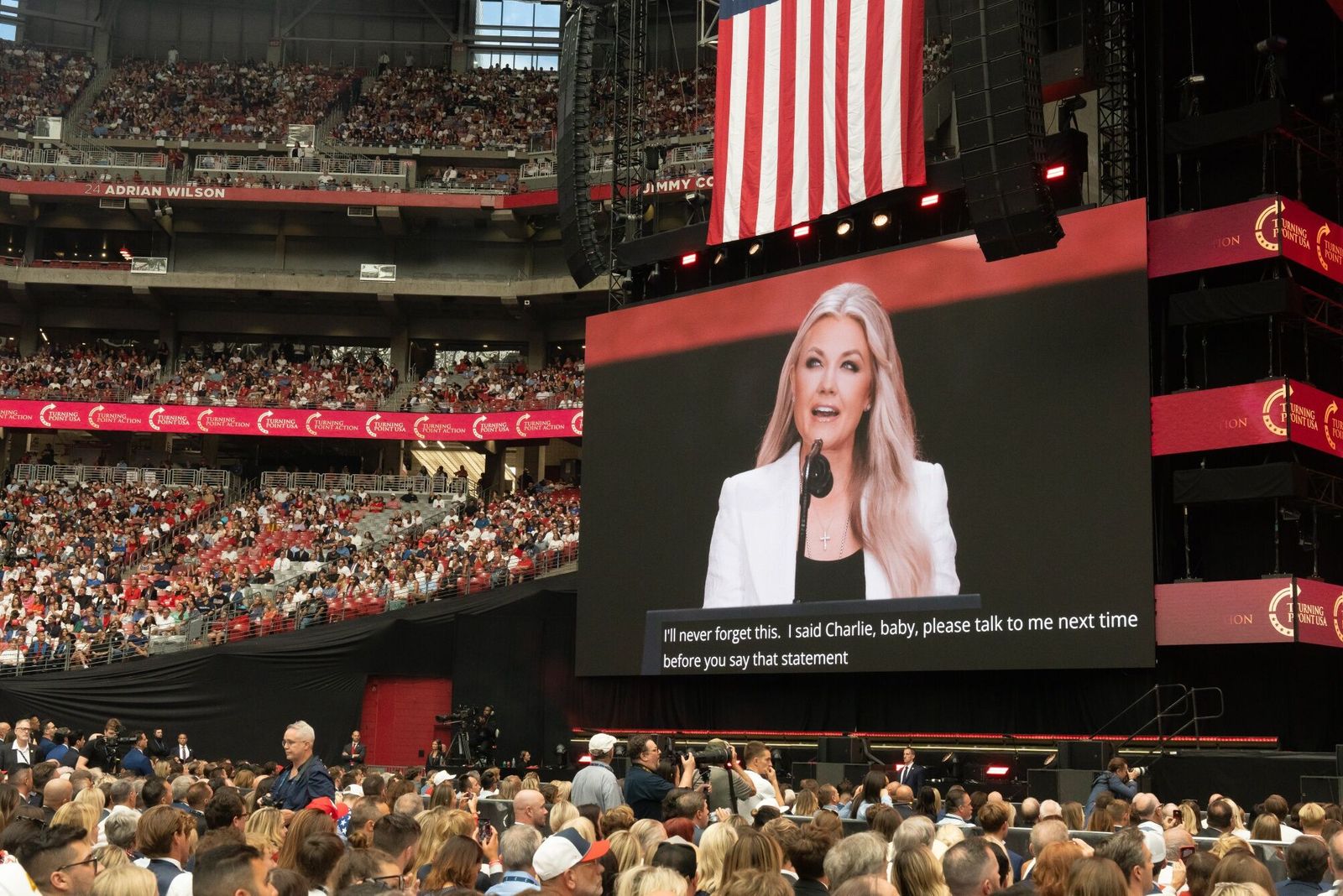 Erika Kirk, chief executive officer of Turning Point USA, on screen, during a memorial service for Turning Point USA founder Charlie Kirk at State Farm Stadium in Glendale, Arizona, US, on Sunday, Sept. 21, 2025. President Donald Trump proclaimed Charlie Kirk a 'martyr for American freedom' in a memorial ceremony to commemorate the political activist as Erika Kirk said she forgave the man who gunned down her husband. Photographer: Rebecca Noble/Bloomberg