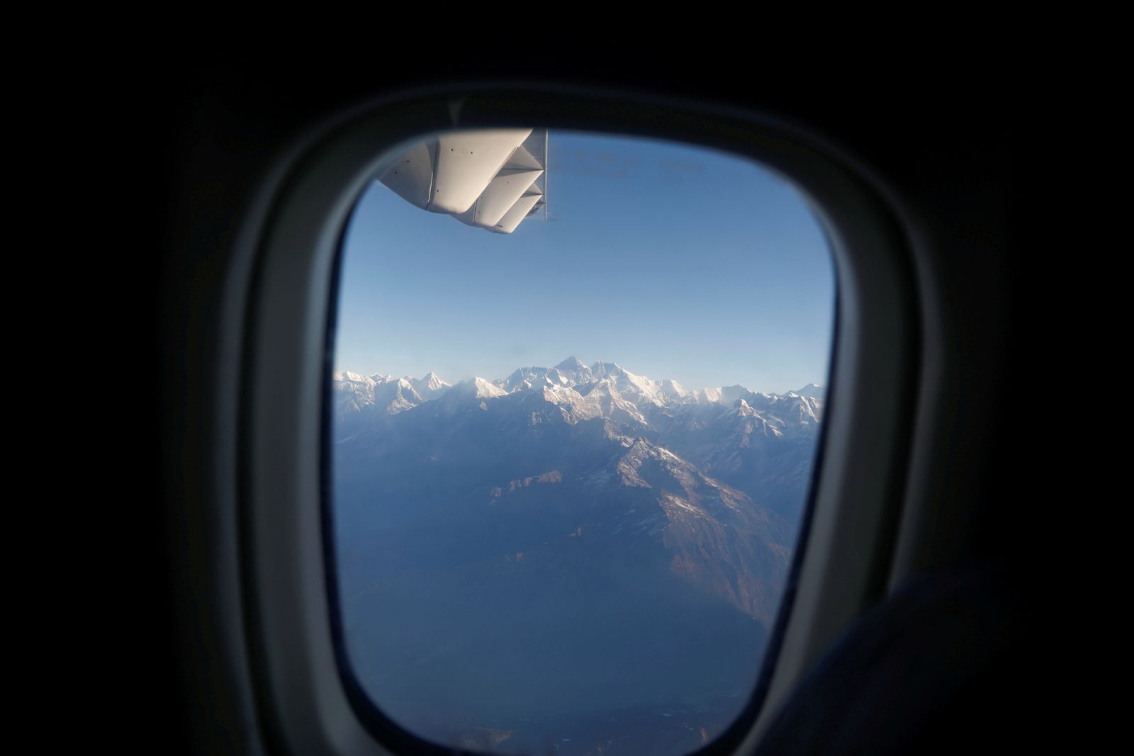 FILE PHOTO: Mount Everest, the world highest peak, and other peaks of the Himalayan range are seen through an aircraft window during a mountain flight from Kathmandu - REUTERS