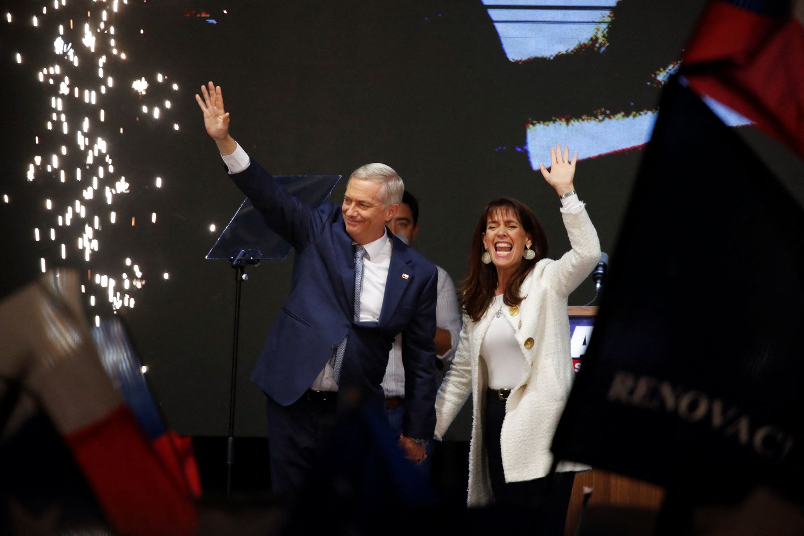 Jose Antonio Kast, presidential candidate of the far-right Republican Party of Chile and his wife Maria Pia Adriasola wave to their supporters as they celebrate after Kast won Chile's presidency in a presidential runoff election, in Santiago, Chile, December 14, 2025. REUTERS/Rodrigo Garrido