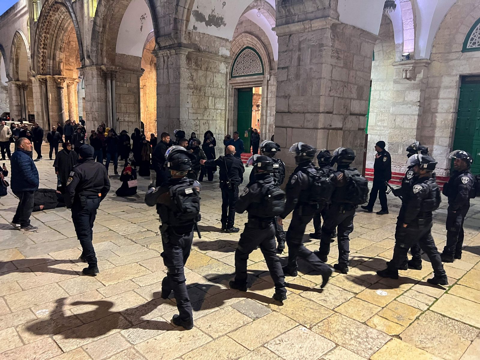 Israeli security forces walk in the Al-Aqsa Mosque compound in Jerusalem on April 5, 2023. - Israeli police said early April 5, 2023 they had entered the Al-Aqsa mosque in Jerusalem to dislodge 