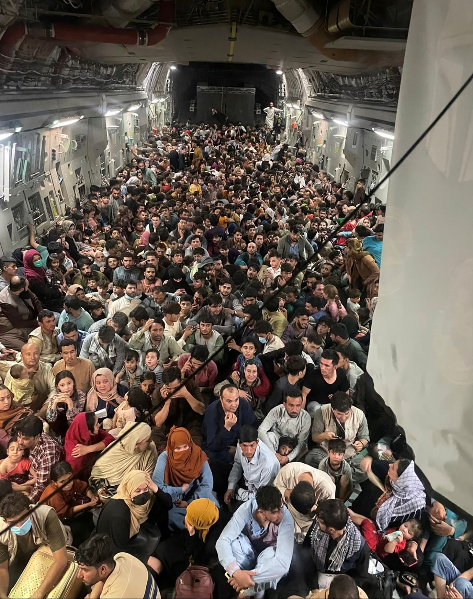 Evacuees crowd the interior of a U.S. Air Force C-17 Globemaster III transport aircraft departing Kabul - via REUTERS