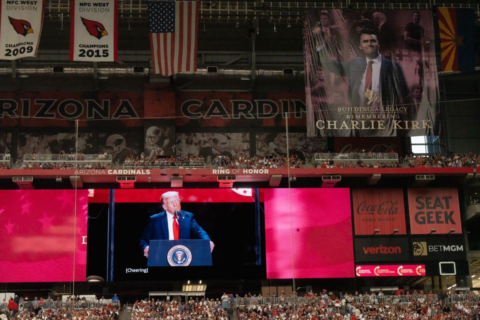 US President Donald Trump during a memorial service for Turning Point USA founder Charlie Kirk at State Farm Stadium in Glendale, Arizona, US, on Sunday, Sept. 21, 2025. President Donald Trump proclaimed Charlie Kirk a 'martyr for American freedom' in a memorial ceremony to commemorate the political activist as Erika Kirk said she forgave the man who gunned down her husband. Photographer: Rebecca Noble/Bloomberg