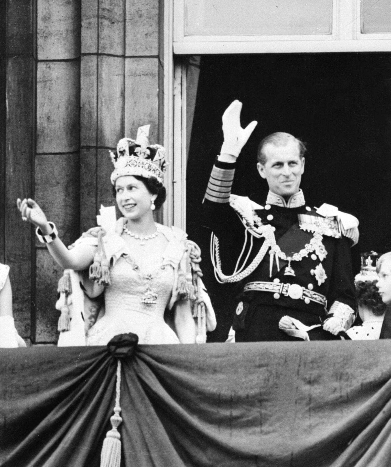 (FILES) In this file photo taken on June 2, 1953 Britain's Queen Elizabeth II (L) accompanied by Britain's Prince Philip, Duke of Edinburgh (R) waves to the crowd, after being crowned  at Westminter Abbey in London. - Queen Elizabeth II, the longest-serving monarch in British history and an icon instantly recognisable to billions of people around the world, has died aged 96, Buckingham Palace said on September 8, 2022. Her eldest son, Charles, 73, succeeds as king immediately, according to centuries of protocol, beginning a new, less certain chapter for the royal family after the queen's record-breaking 70-year reign. (Photo by INTERCONTINENTALE / AFP) - AFP