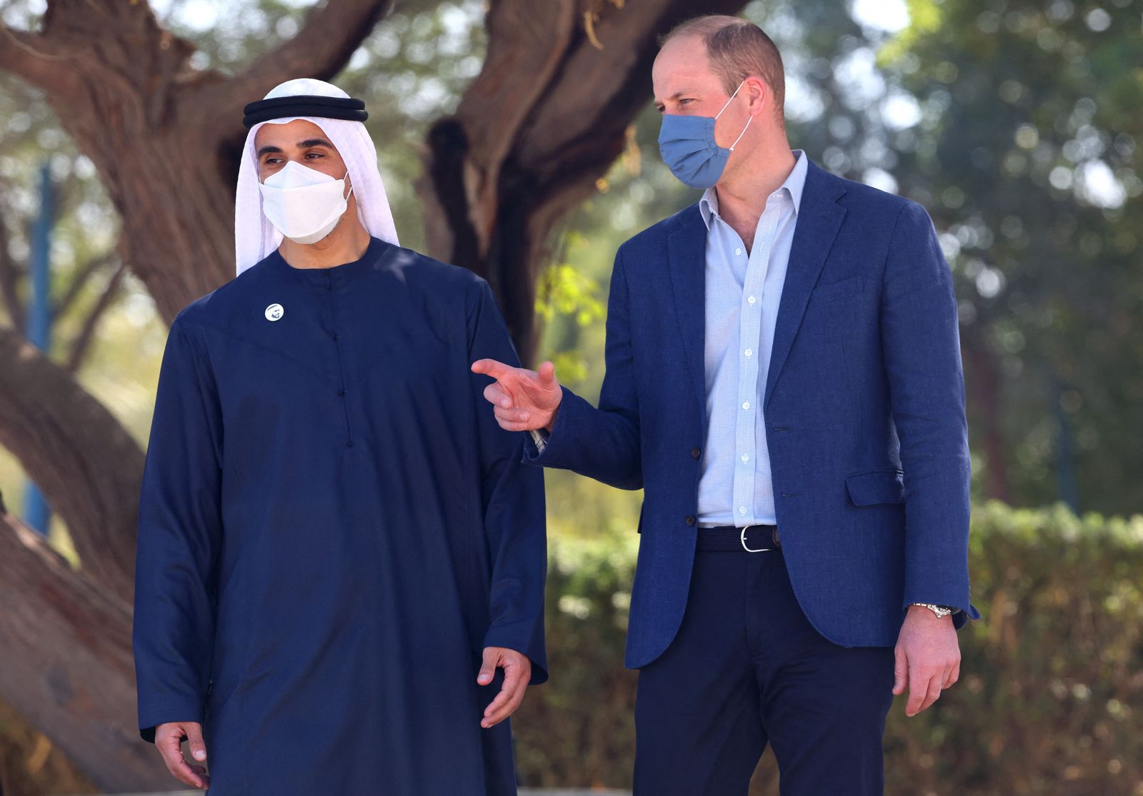 Britain's Prince William, Duke of Cambridge, gestures as she tours alongside Sheikh Khaled bin Mohamed bin Zayed al-Nahyan, chairman of Abu Dhabi's Executive Office, the Jubail Magrove Park in Abu Dhabi during an official visit to the United Arab Emirates on February 10, 2022. - Prince William's climate-focused visit also aims to bolster ties between the two countries after the UAE, a former British protectorate, marked 50 years since its founding in 1971. (Photo by Giuseppe CACACE / AFP) - AFP