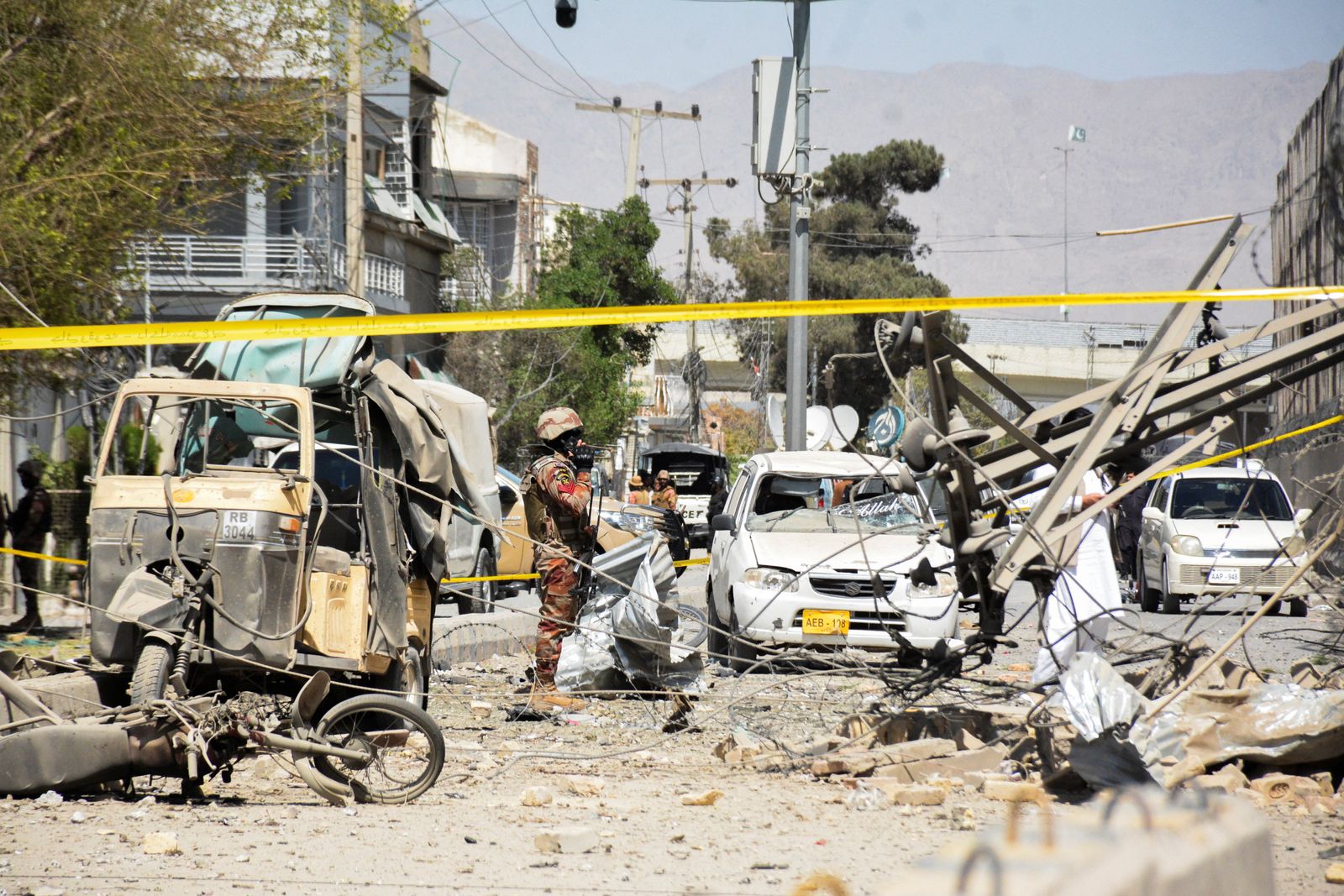 A paramilitary soldier stands amid the debris after a bomb blast near the Frontier Corps headquarters in Quetta, Pakistan September 30, 2025. REUTERS/Stringer