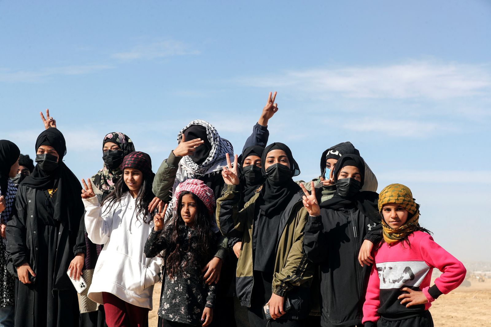 Bedouin women and girls gesture during a protest against forestation at the Negev desert village of Sawe al-Atrash, southern Israel - REUTERS