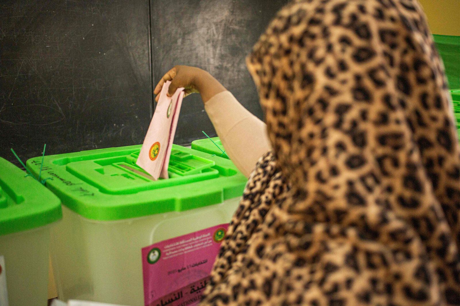 A woman casts her ballot at a polling station in Nouakchott on May 13, 2023. Voters in the West African nation of Mauritania began casting ballots on May 13, 2023 in the first legislative and local elections since President Mohamed Ould Ghazouani came to power in 2019. (Photo by MED LEMINE RAJEL / AFP) - AFP