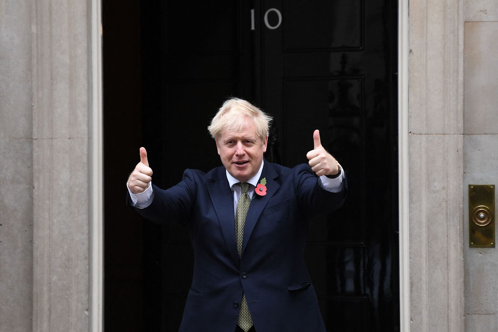 (FILES) In this file photo taken on October 23, 2020 Britain's Prime Minister Boris Johnson gestures as he meets with fundraisers for the Royal British Legion and service personnel, outside number 10 Downing Street as the British public is being urged to find new ways to support this year's Poppy Appeal during the novel coronavirus COVID-19 pandemic. - Britain's Prime Minister Boris Johnson wins Tory party no-confidence vote on June 6, 2022. (Photo by Daniel LEAL / AFP) - AFP