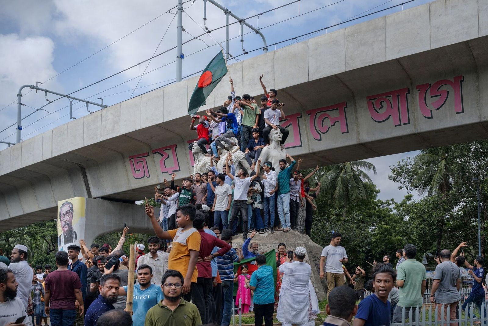 People celebrate following the resignation of Bangladesh Prime Minister Sheikh Hasina, in Dhaka, Bangladesh, on Monday, Aug. 5, 2024. Hasina has resigned and fled the country with her sister as anti-government protesters converged on the capital, according to local news reports. Photographer: Febeha Monir/Bloomberg