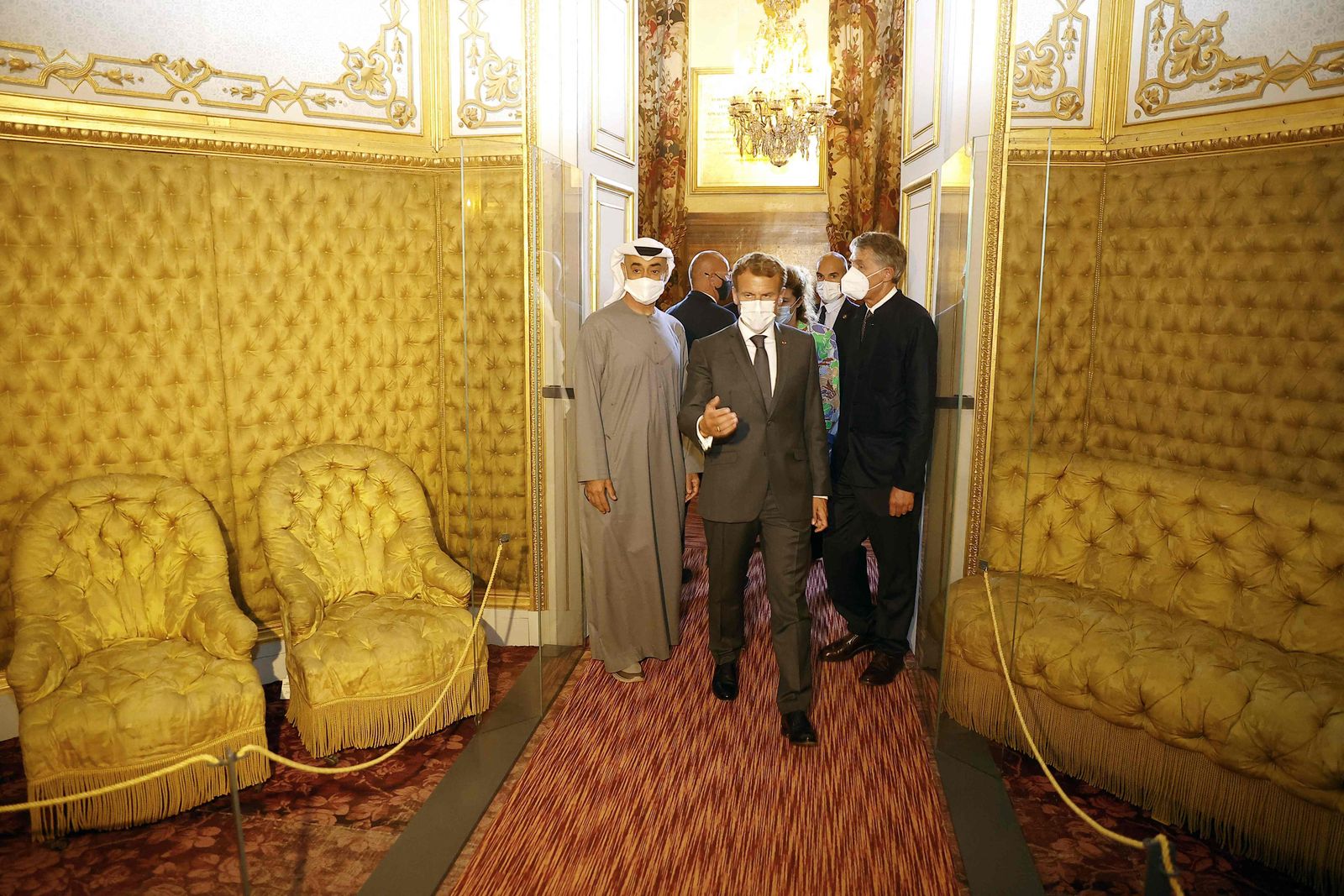 French President Emmanuel Macron (C) and Crown Prince of Abu Dhabi and Deputy Supreme Commander of the UAE Armed Forces, Sheikh Mohamed bin Zayed Al Nahyan (L), visit the Imperial theatre of the Chateau of Fontainebleau, in Fontainebleau, outside Paris, in September 15, 2021. (Photo by Ian LANGSDON / POOL / AFP) - AFP