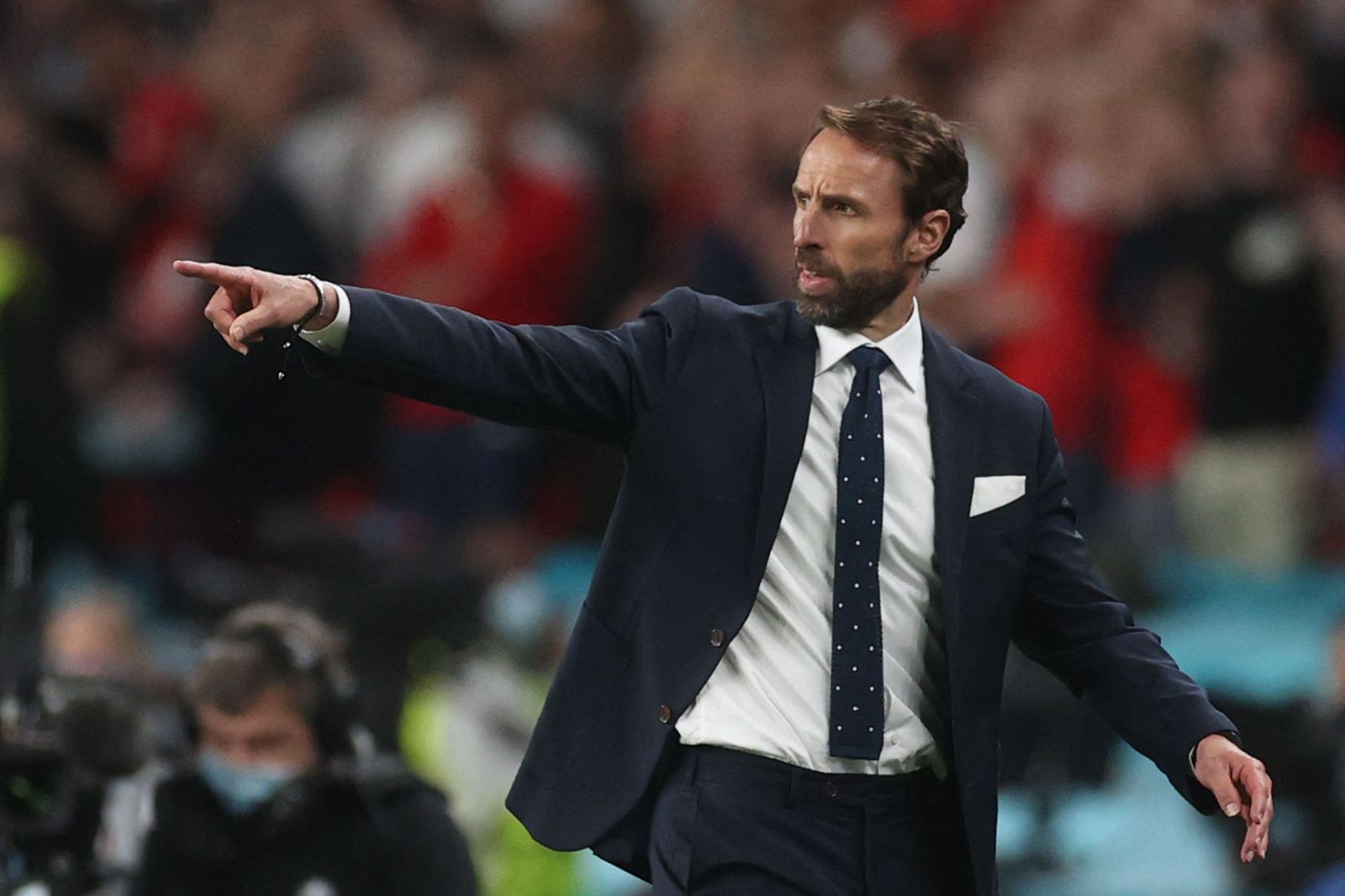 England's coach Gareth Southgate gestures during the UEFA EURO 2020 semi-final football match between England and Denmark at Wembley Stadium in London on July 7, 2021. (Photo by CARL RECINE / POOL / AFP) - AFP