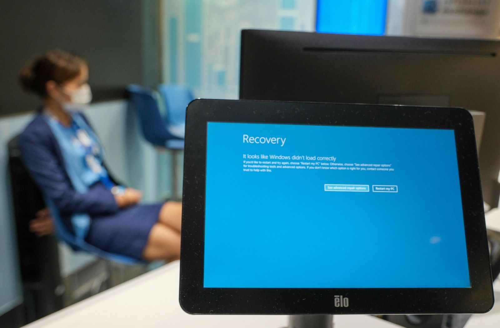 The Microsoft Corp. Windows Recovery screen displayed at a currency exchange kiosk during a worldwide systems outage at Hong Kong International Airport in Hong Kong, China, on Friday, July 19, 2024. Computer systems failed across the globe on Friday, taking down services at airlines, banks and the London Stock Exchange after a widely used cybersecurity program crashed and�Microsoft separately reported problems with its cloud services. Photographer: Yik Yeung-man/Bloomberg