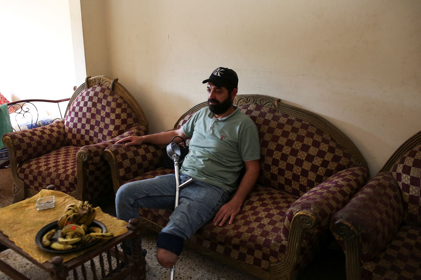 Hamza Dugmosh, 41, mourns 22 relatives, including his four daughters killed in an Israeli airstrike in Gaza on September 20, during an interview with Reuters in Giza, Egypt, September 25, 2025. Dugmosh with his wife and son fled from Gaza to Egypt in December 2023, for medical treatment after losing his left leg and sustaining multiple abdominal injuries in an Israeli airstrike following the events of October 7, 2023. REUTERS/Hadeer Mahmoud