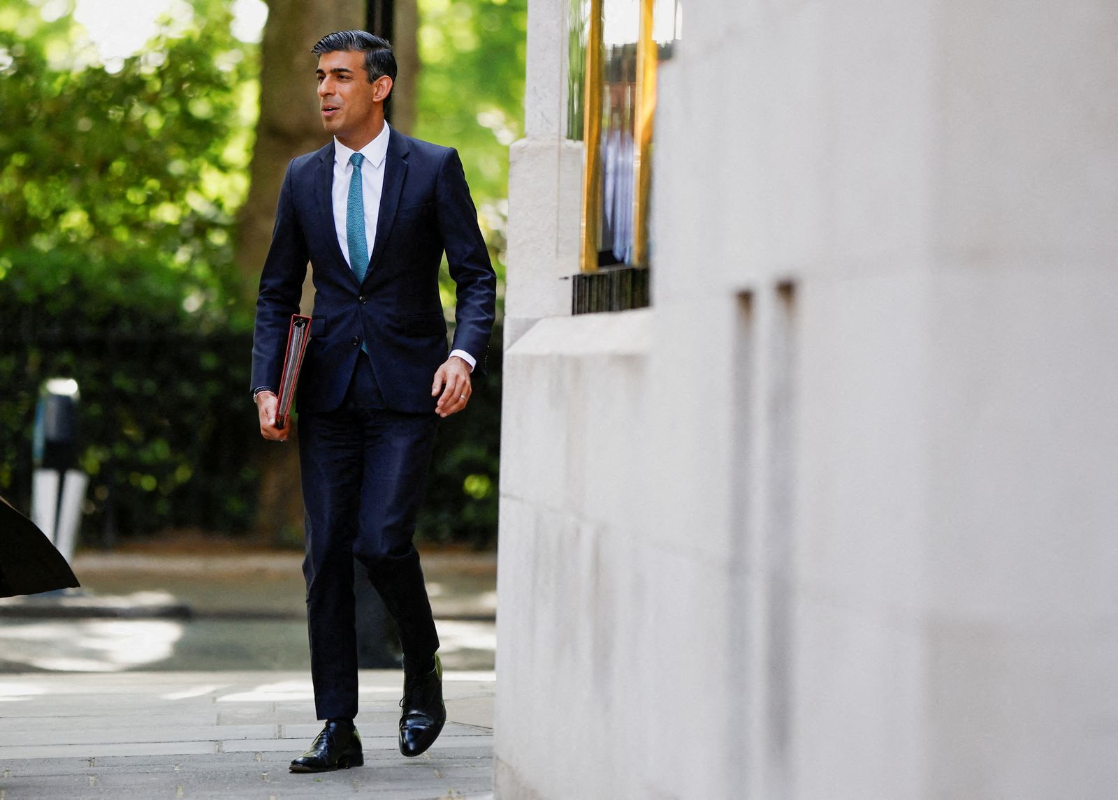 FILE PHOTO: British Chancellor of the Exchequer Rishi Sunak leaves Millbank Studios after a media interview in London - REUTERS