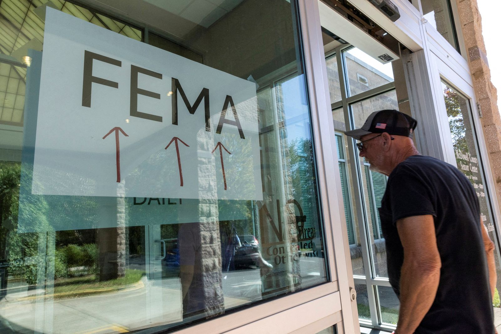 FILE PHOTO: A resident enters a FEMA improvised station to attend claims by local residents affected by floods following the passing of Hurricane Helene, in Marion, North Carolina, U.S., October 5, 2024. REUTERS/Eduardo Munoz/File Photo