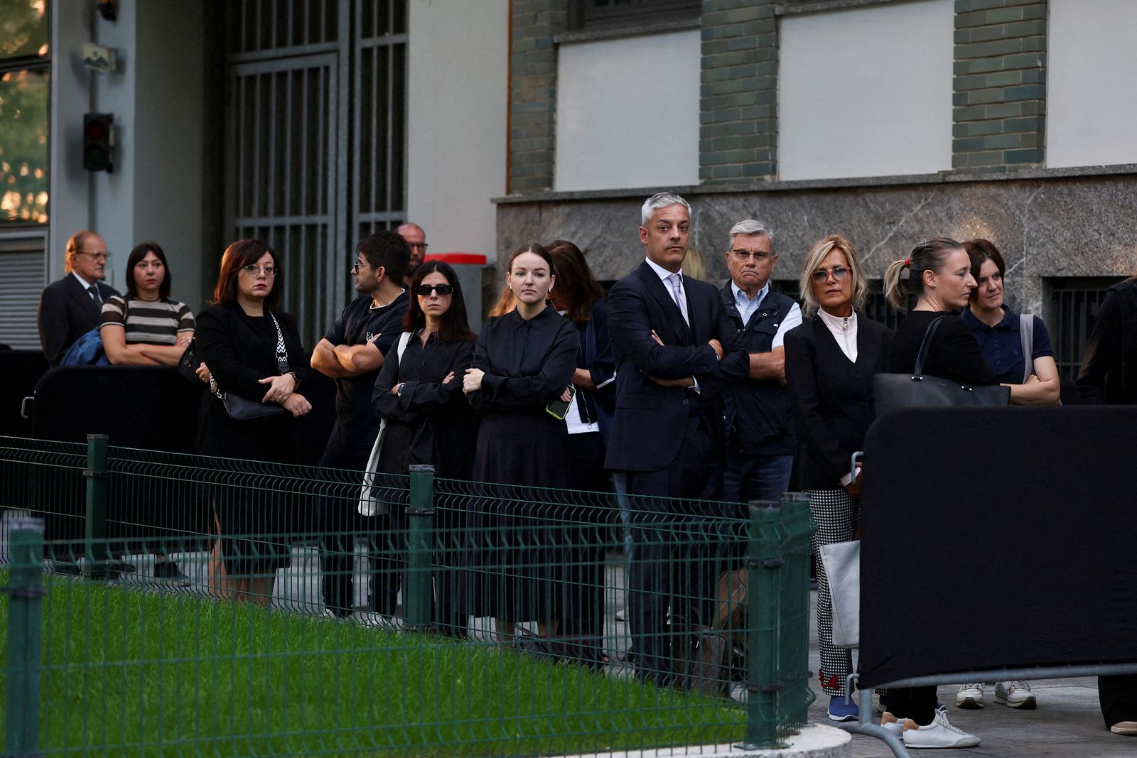 People queue outside the Armani/Teatro to pay tribute, where designer Giorgio Armani is to lie in state, following his death at the age of 91, in Milan, Italy September 6, 2025. REUTERS/Gonzalo Fuentes REFILE- CORRECTING FROM 'AS DESIGNER GIORGIO ARMANI LIES IN STATE' TO 'WHERE DESIGNER GIORGIO ARMANI IS TO LIE IN STATE'.