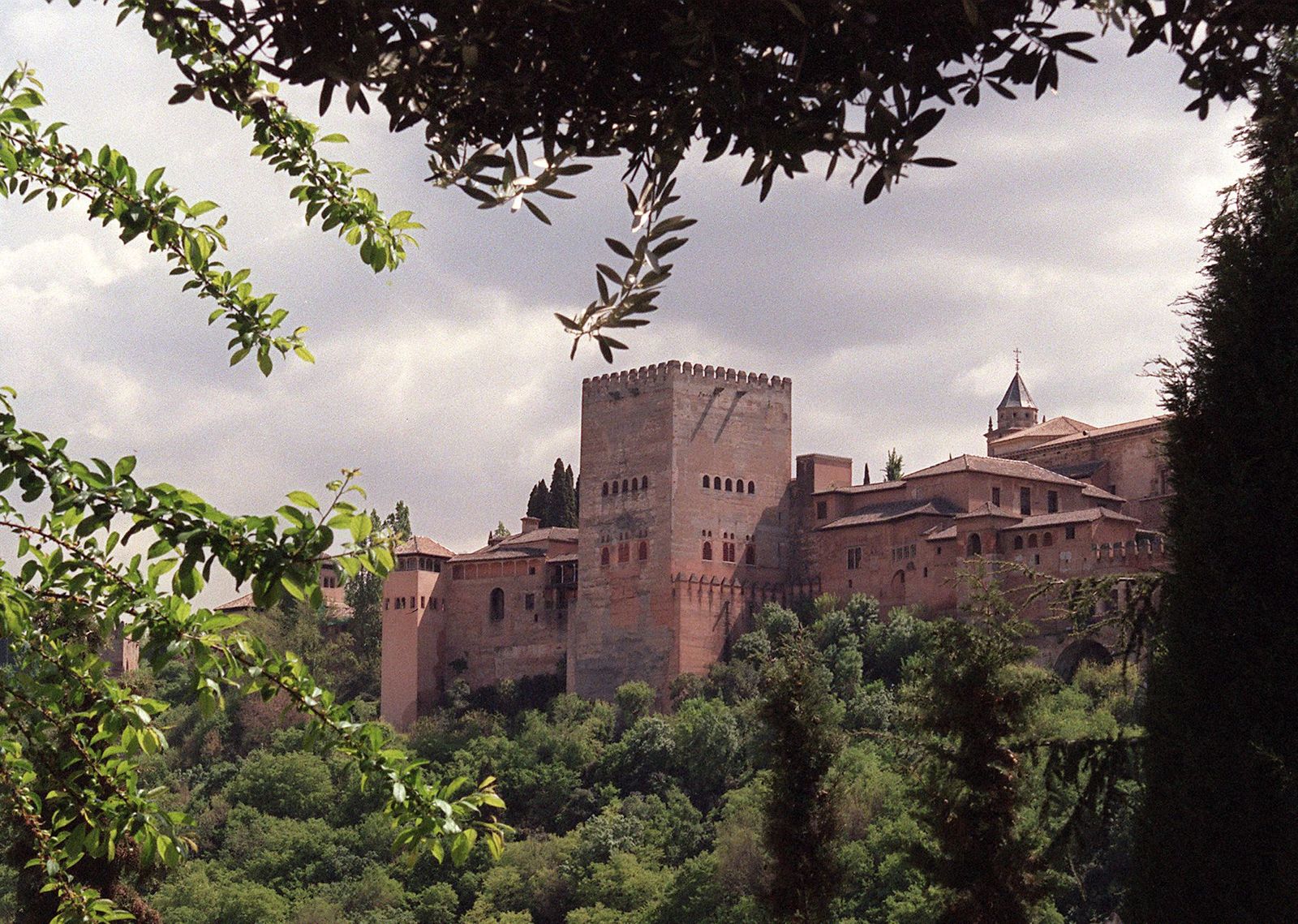 (FILES) This file photo taken on October 8, 1997, shows Alhambra Palace in Granada. - Earthen construction is experiencing a resurgence of interest among architects: This ancient material reduces CO2 emissions from buildings while allowing them to better resist rising temperatures. But its implementation is costly and delicate due to the lack of qualified manpower. (Photo by Dominique FAGET / AFP) - AFP