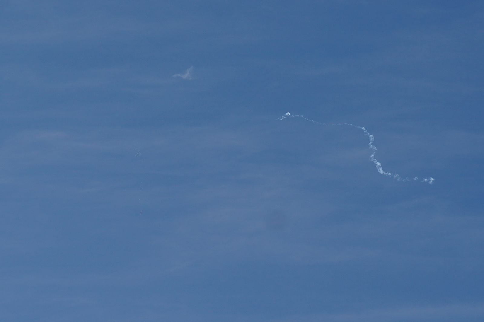 A view of what is believed to be a suspected Chinese spy balloon when it was shot down, seen from Holden Beach - REUTERS