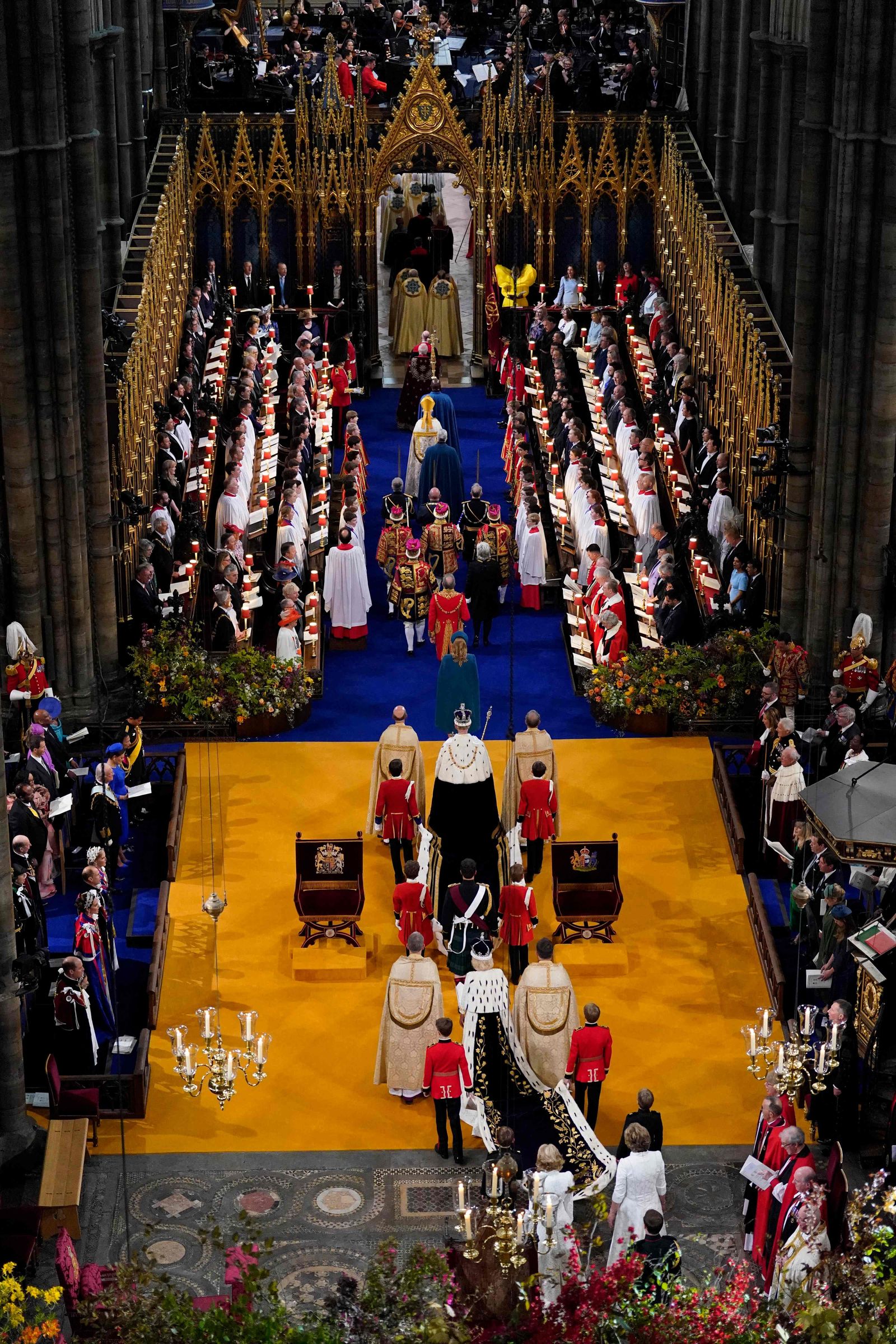 Britain's King Charles III wearing the Imperial state Crown, and Queen Camilla, wearing a modified version of Queen Mary's Crown leave Westminster Abbey after the Coronation Ceremonies in central London on May 6, 2023. - The set-piece coronation is the first in Britain in 70 years, and only the second in history to be televised. Charles will be the 40th reigning monarch to be crowned at the central London church since King William I in 1066. Outside the UK, he is also king of 14 other Commonwealth countries, including Australia, Canada and New Zealand. (Photo by Andrew Matthews / POOL / AFP) - AFP