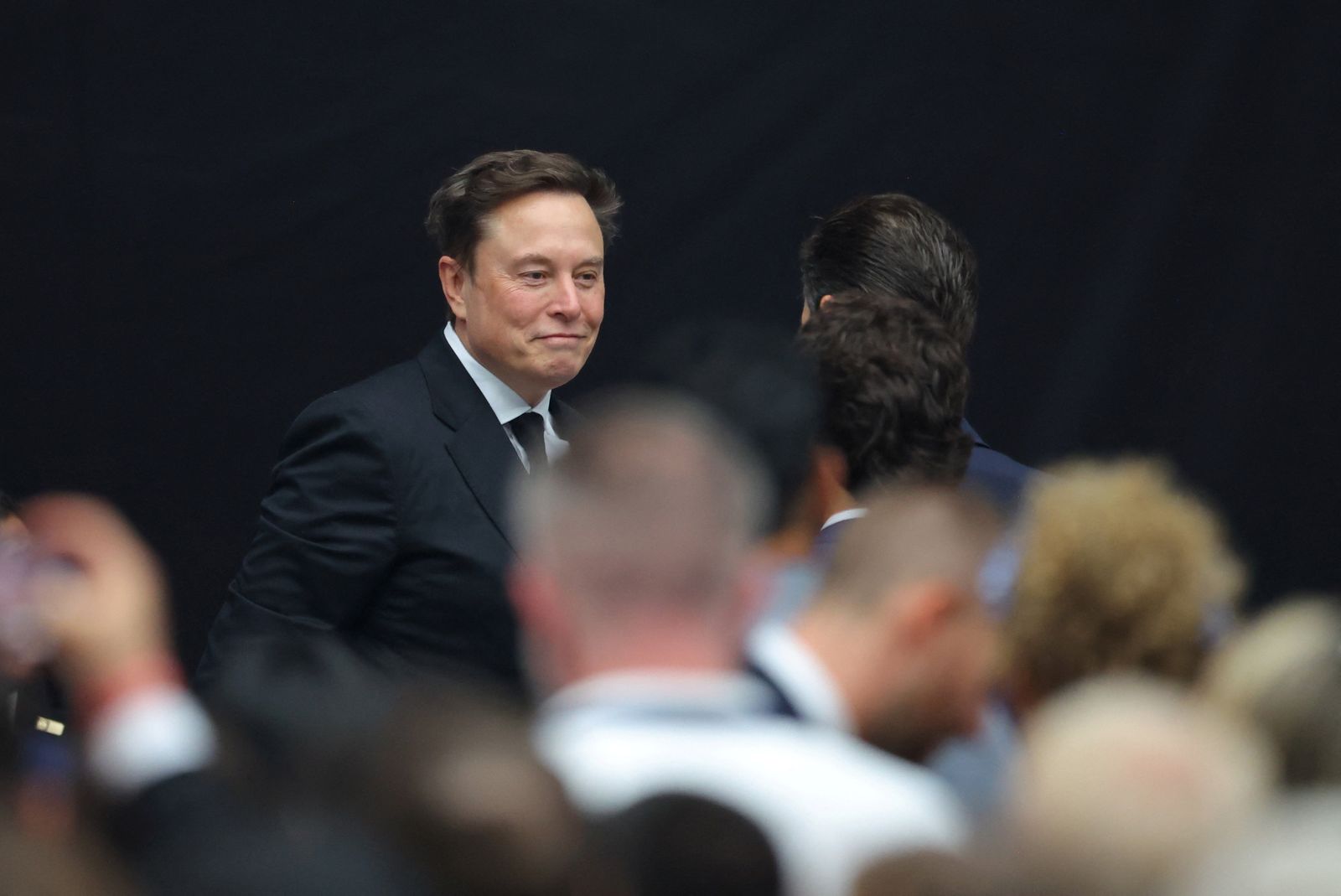 Elon Musk arrives for a memorial service for slain conservative commentator Charlie Kirk at State Farm Stadium, on the day of a memorial service for slain conservative commentator Charlie Kirk, in Glendale, Arizona, U.S., September 21, 2025.  REUTERS/Carlos Barria