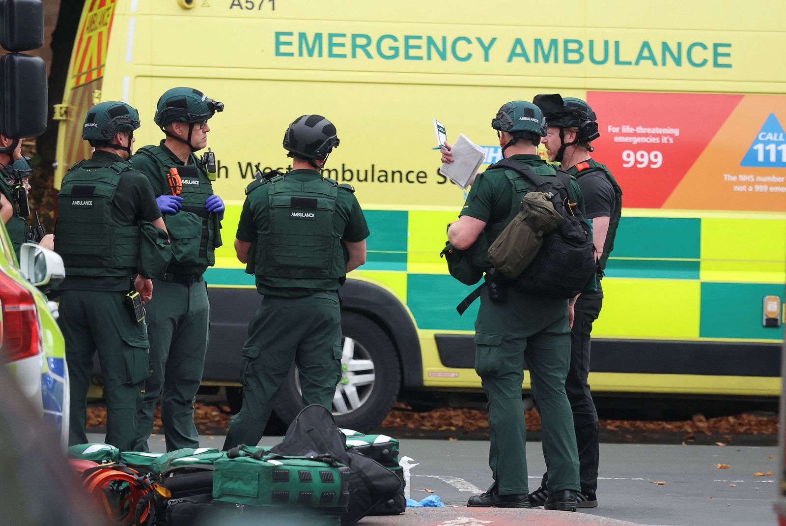 Emergency personnel work at the scene, after a reported attack in which a car was driven at pedestrians and one person was stabbed near a synagogue in north Manchester, Britain, October 2, 2025. REUTERS/Phil Noble