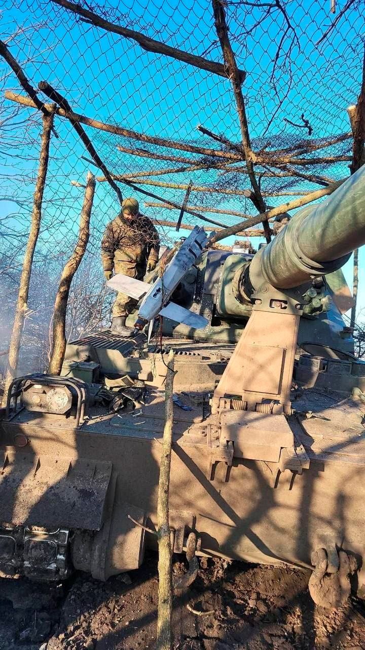 Russian made ZALA Lancet-3 loitering munition is seen stuck in metal net installed over an AHS Krab self propelled howitzer at a position of Ukrainian service members in an unknown location in Ukraine