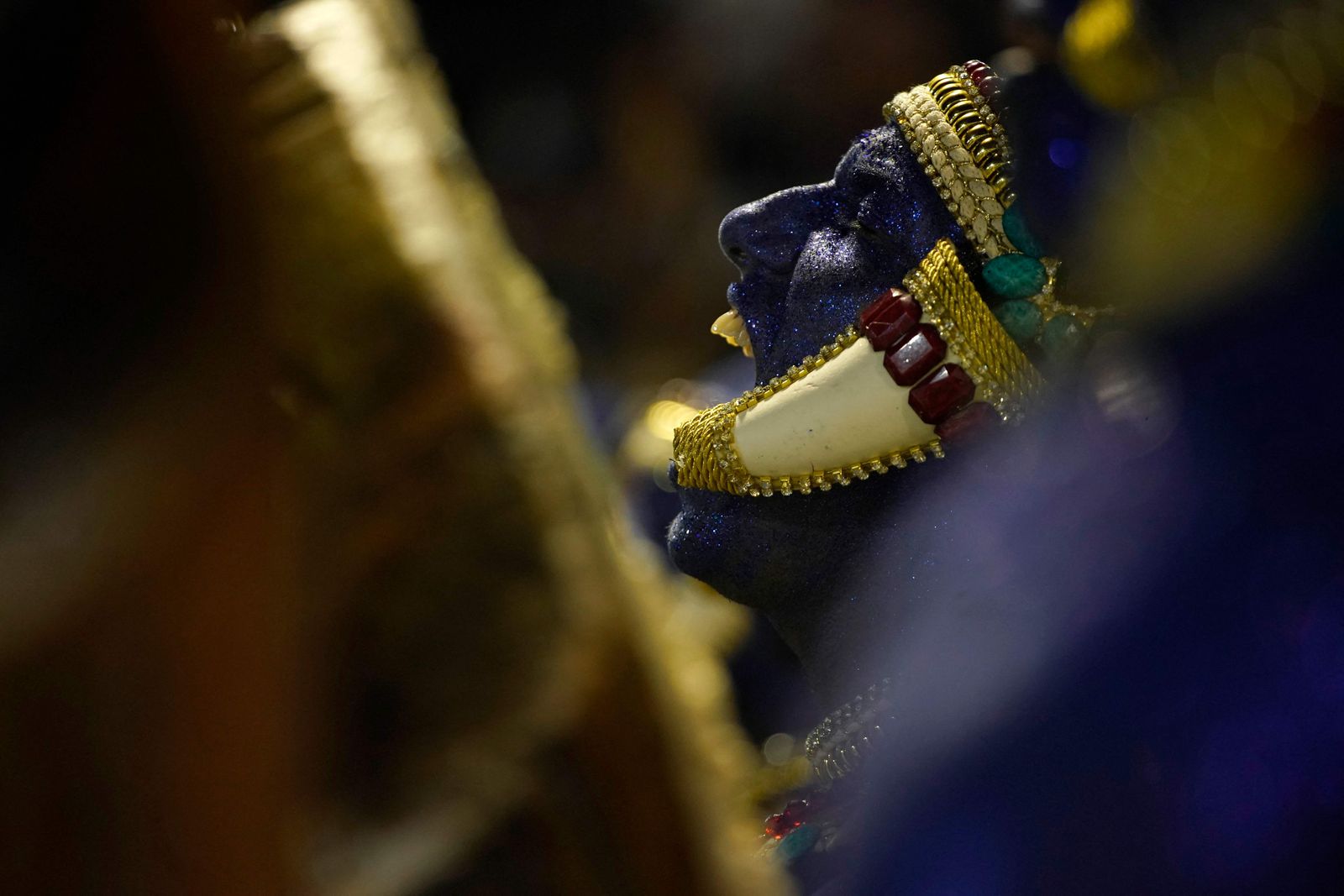 Members of Vila Isabel samba school perform during the second night of Rio's Carnival parade at the Sambadrome Marques de Sapucai in Rio de Janeiro on April 24, 2022. (Photo by Mauro PIMENTEL / AFP) - AFP