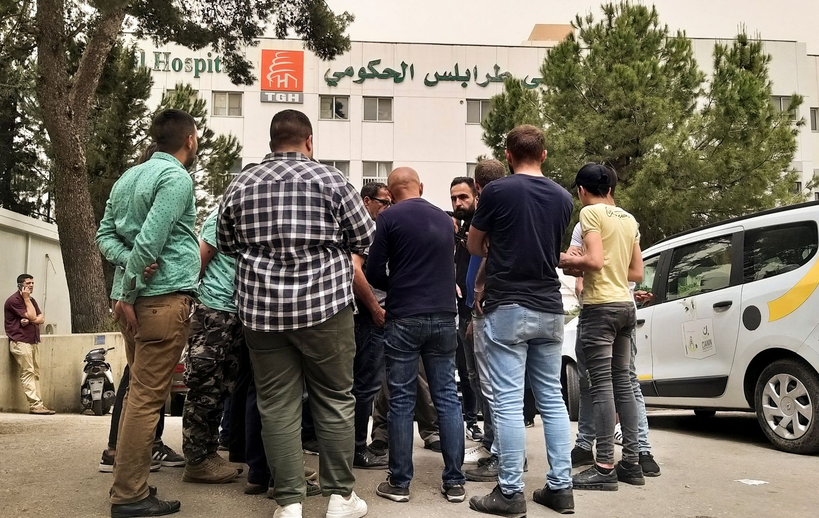 Relatives of people who died when a boat capsized off the Lebanese coast of Tripoli overnight, gather outisde a governmental hospital in Tripoli - REUTERS