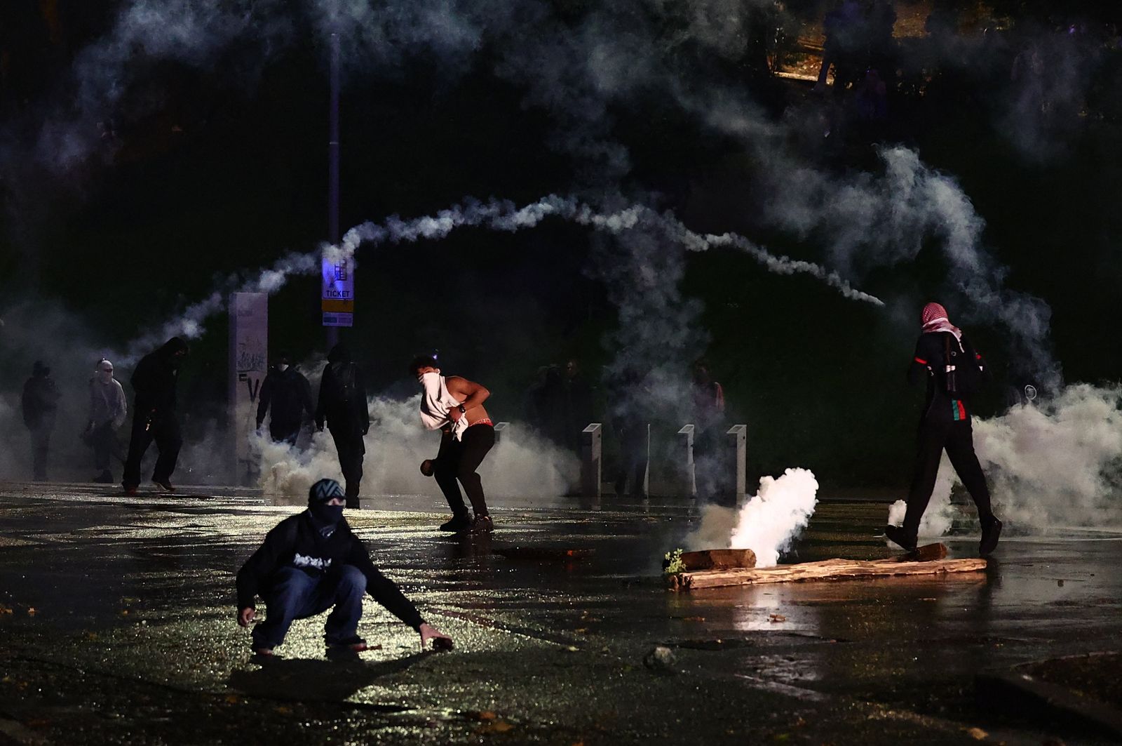 Soccer Football - FIFA World Cup - UEFA Qualifiers - Protesters rally against the Israeli national team - Udine, Italy - October 14, 2025 Tear gas is used as police clash with pro-Palestine protestors during a march against the Israeli football team ahead of the Italy v Israel match REUTERS/Yara Nardi