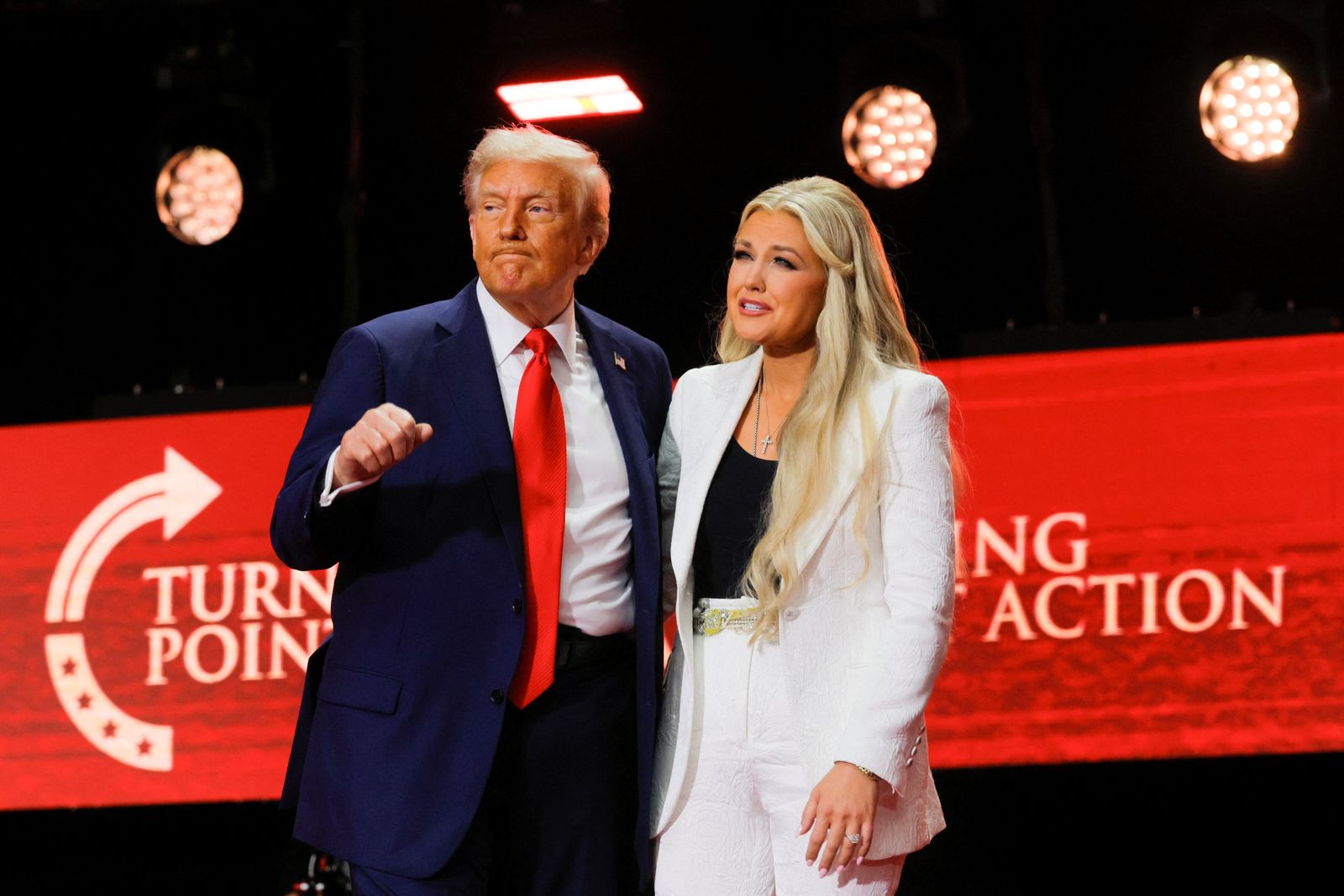 U.S. President Donald Trump gestures next to Erika Kirk, wife of slain conservative commentator Charlie Kirk and the new CEO of Turning Point USA, during a memorial service at State Farm Stadium, in Glendale, Arizona, U.S., September 21, 2025.  REUTERS/Brian Snyder