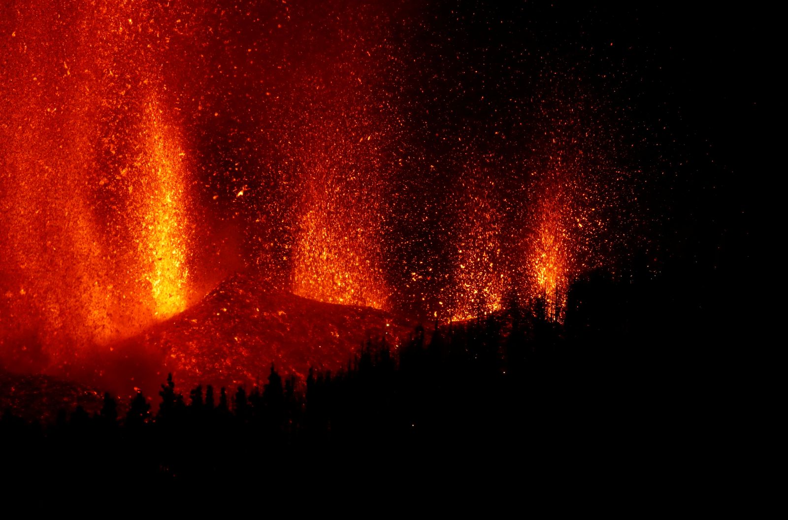 Lava rises downhill following the eruption of a volcano in Spain - REUTERS