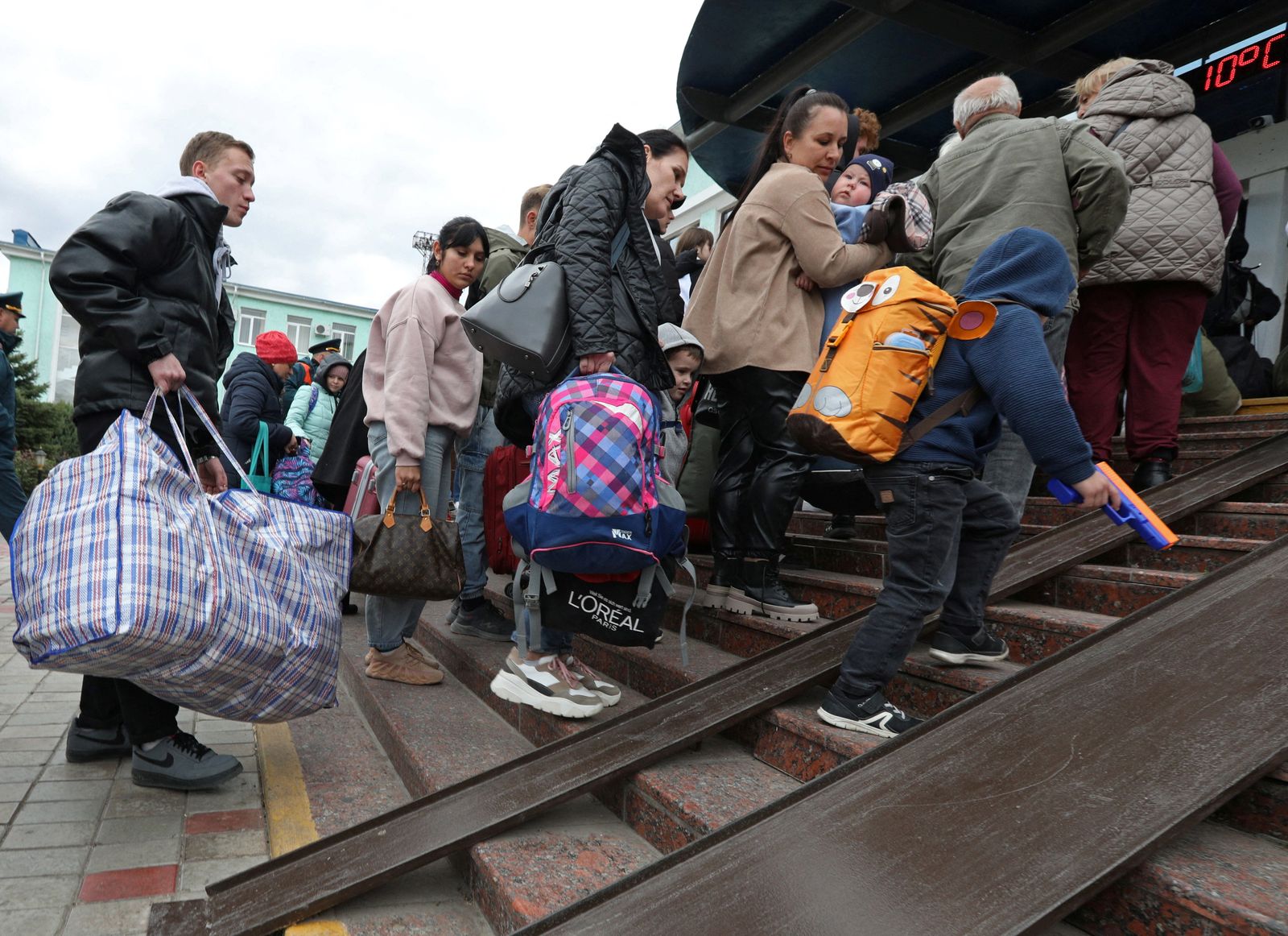 Civilians evacuated from the Russian-controlled Kherson region of Ukraine arrive in Dzhankoi - REUTERS