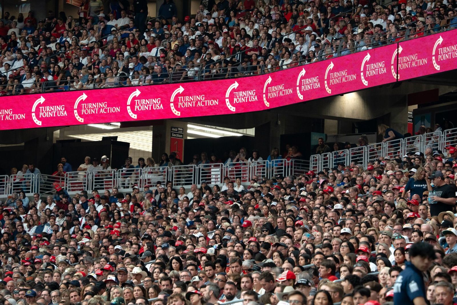 Mourners during a memorial service for Turning Point USA founder Charlie Kirk at State Farm Stadium in Glendale, Arizona, US, on Sunday, Sept. 21, 2025. President Donald Trump proclaimed Charlie Kirk a 'martyr for American freedom' in a memorial ceremony to commemorate the political activist as Erika Kirk said she forgave the man who gunned down her husband. Photographer: Rebecca Noble/Bloomberg