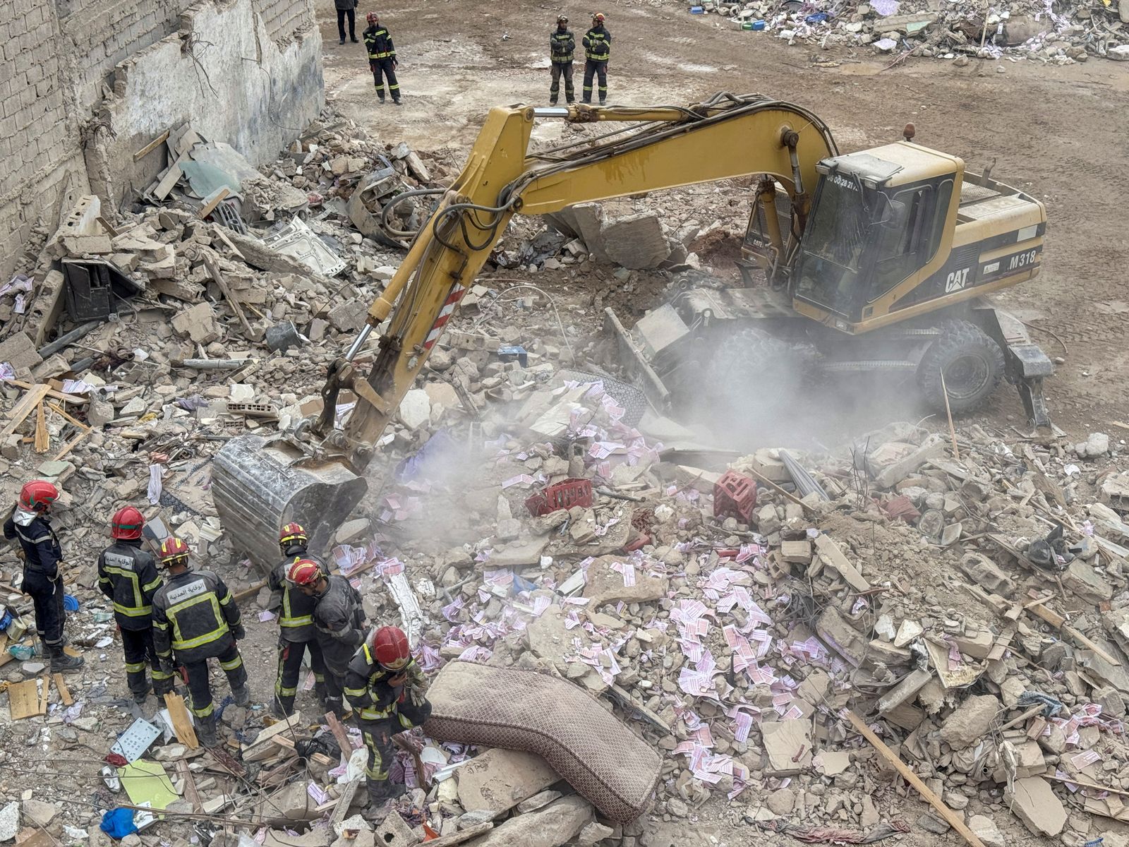 Rescuers work at the site of the collapse of two buildings in Fes, Morocco, December 10, 2025. REUTERS/Said Echarif