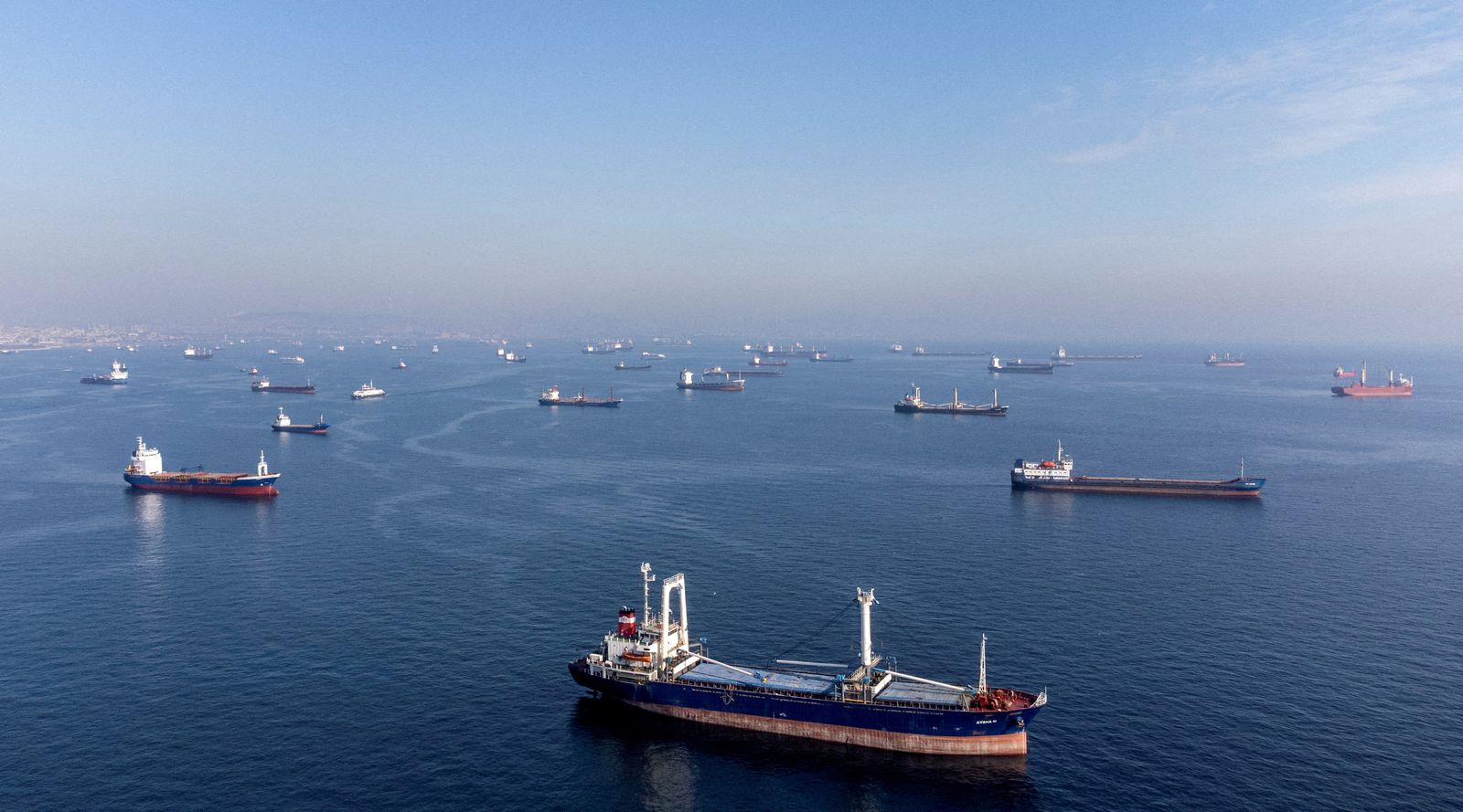 FILE PHOTO: Commercial vessels including vessels which are part of Black Sea grain deal wait to pass the Bosphorus strait off the shores of Yenikapi in Istanbul - REUTERS