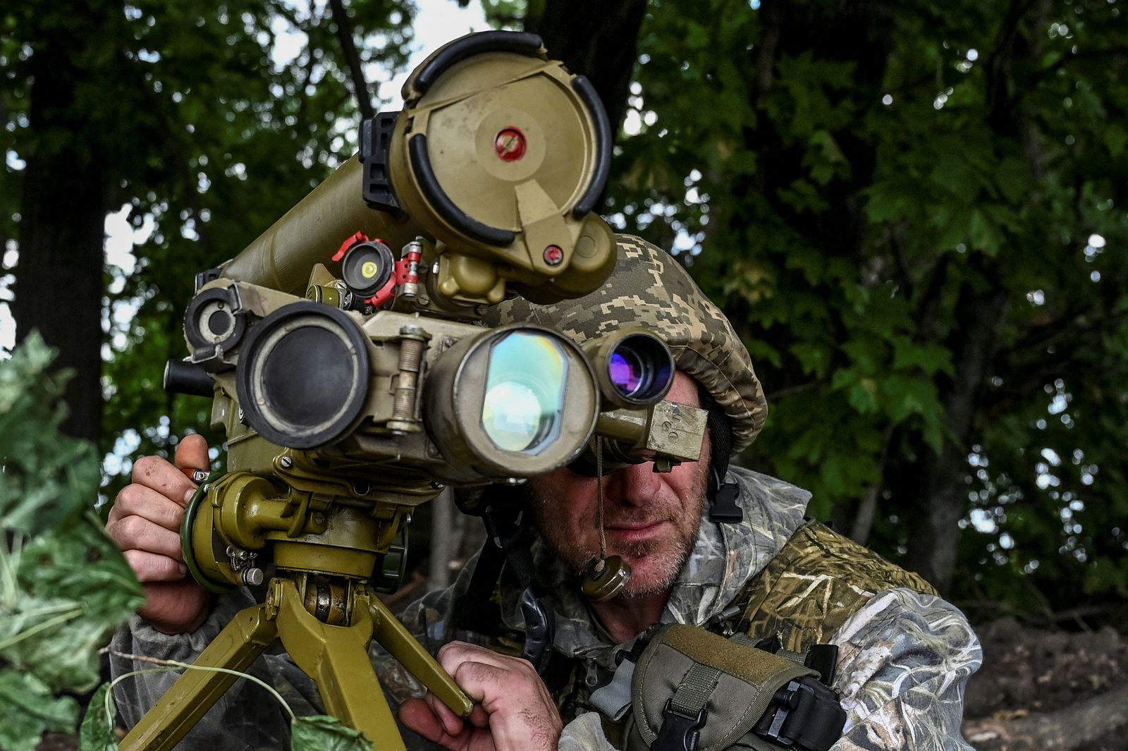 A Ukrainian serviceman checks an anti-tank grenade launcher at a position near a frontline in Zaporizhzhia region - REUTERS