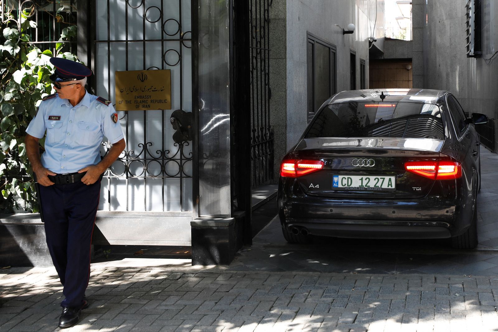 Police officers stand in front of the Embassy of the Islamic Republic of Iran in Tirana - REUTERS
