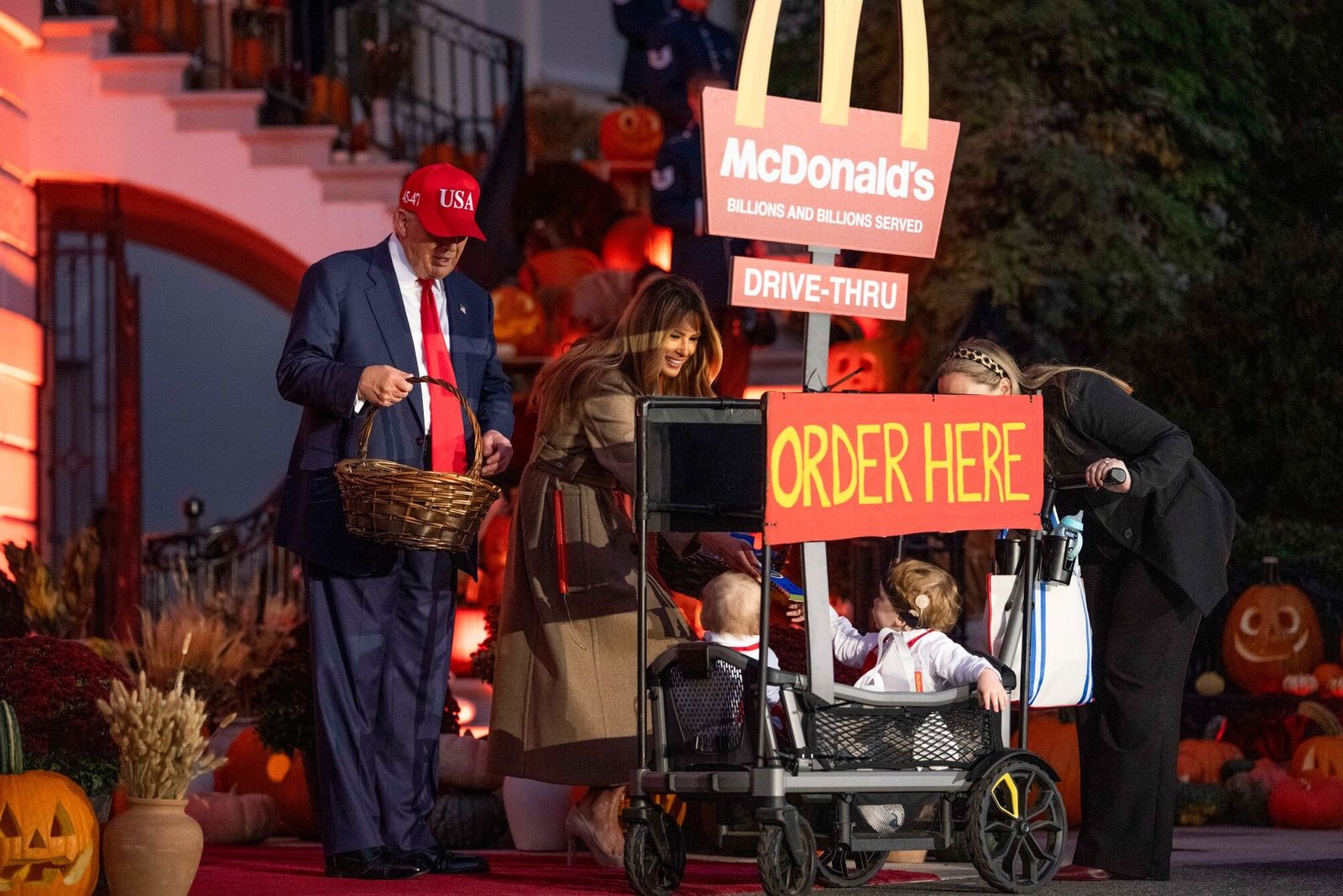 US President Donald Trump, left, and First Lady Melania Trump greet children dressed up in costume during a Halloween event on the South Lawn of the White House in Washington, DC, US, on Thursday, Oct. 30, 2025. The US will proceed with an investigation that opens the door to new tariffs on goods from China, despite the two nations� fresh truce, President Donald Trump�s top trade negotiator said.�Photographer: Aaron Schwartz/CNP/Bloomberg