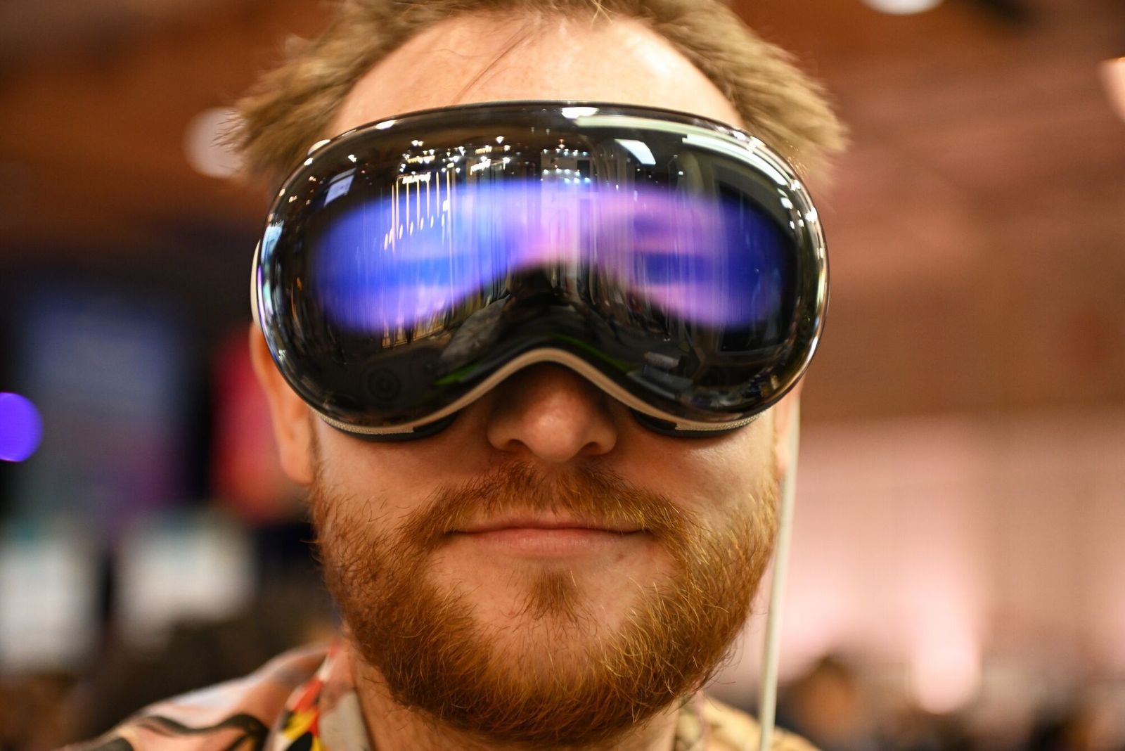 An attendee wearing an Apple Vision Pro virtual reality headset at the Web Summit in Lisbon, Portugal, on Tuesday, Nov. 12, 2024. The annual conference gathers key industry figures in technology. Photographer: Zed Jameson/Bloomberg