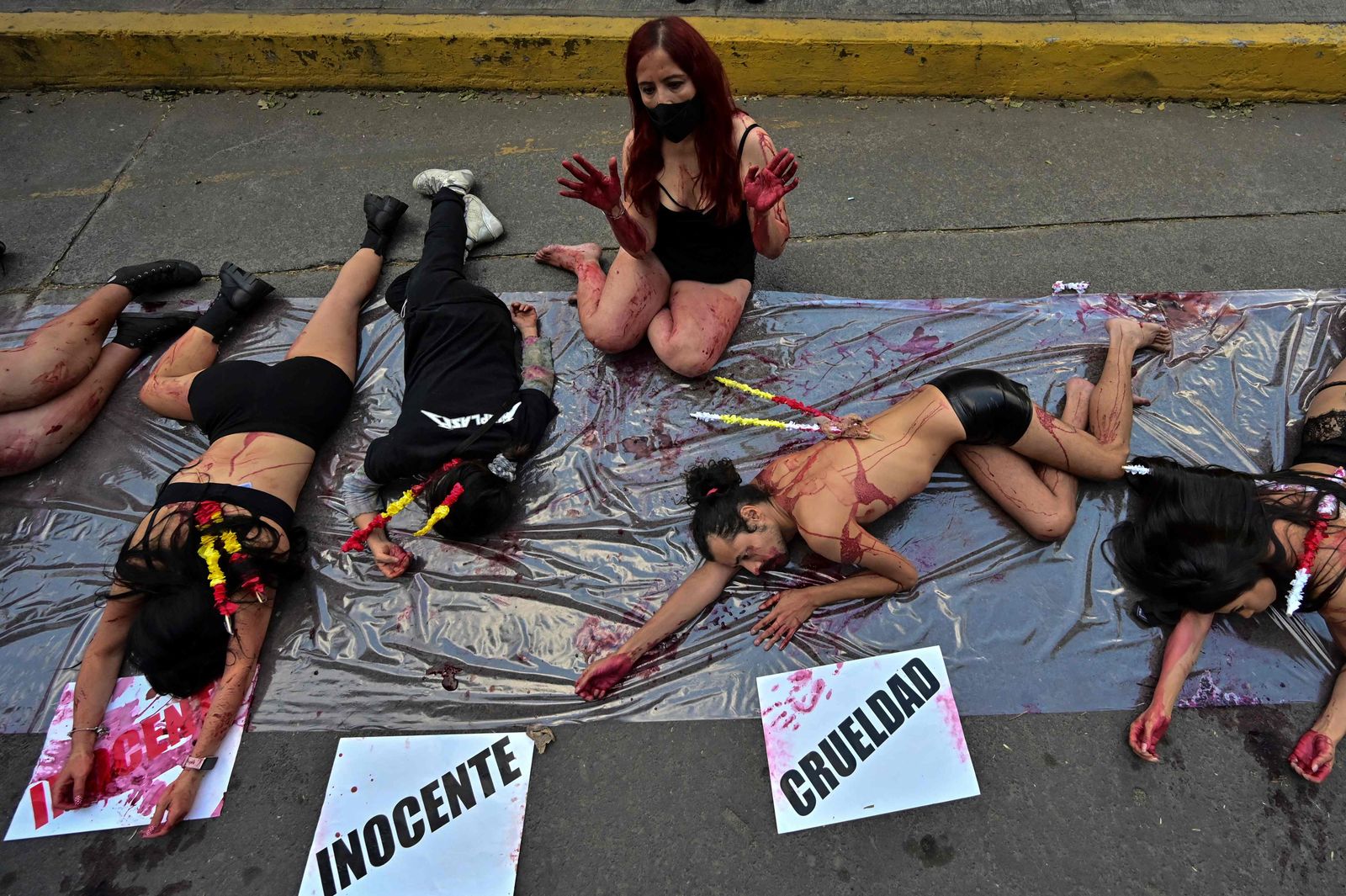 Anti-bullfighting activists demonstrate outside the Plaza Mexico bullring during its 76th anniversary, in Mexico City, on February 5, 2022. - After five centuries, bullfighting could be banished from Mexico City by a parliamentary initiative that confronts the thesis of animal abuse and the rights of minorities. (Photo by Pedro PARDO / AFP) - AFP