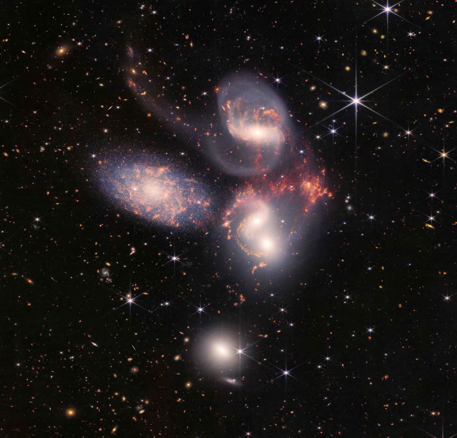 This image released by NASA on July 12, 2022, shows Stephan�s Quintet captured by the James Webb Space Telescope (JWST), a visual grouping of five galaxies, in a new light. This enormous mosaic is JWST�s largest image to date, covering about one-fifth of the Moon�s diameter. It contains over 150 million pixels and is constructed from almost 1,000 separate image files. - The JWST is the most powerful telescope launched into space and it reached its final orbit around the sun, approximately 930,000 miles from Earths orbit, in January, 2022. The technological improvements of the JWST and distance from the sun will allow scientists to see much deeper into our universe with greater detail. (Photo by Handout / NASA / AFP) / RESTRICTED TO EDITORIAL USE - MANDATORY CREDIT 