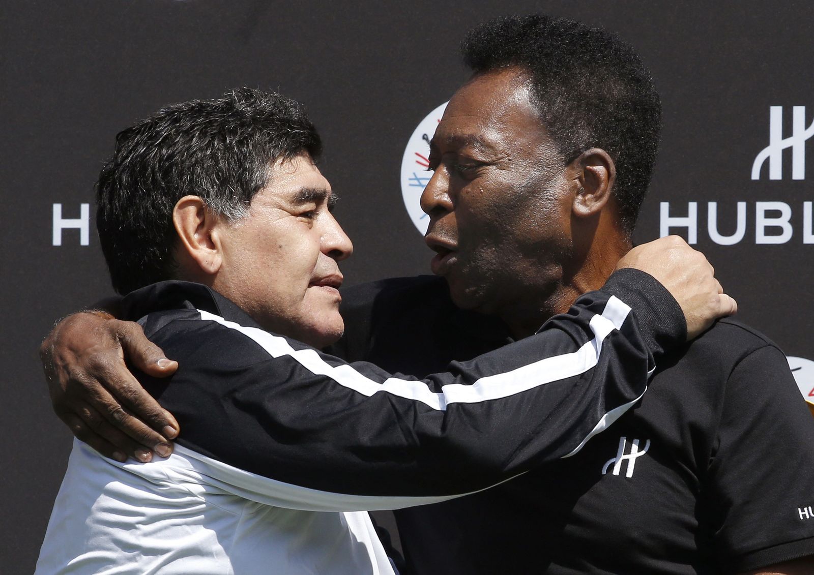 (FILES) In this file photo taken on June 09, 2016 Former Argentinian football international Diego Maradona (L) and former Brazilian footballer Pele pose after a football match organised by Swiss luxury watchmaker Hublot at the Jardin du Palais Royal in Paris on June 9, 2016, on the eve of the Euro 2016 European football championships. - Brazilian football icon Pele, widely regarded as the greatest player of all time and a three-time World Cup winner who masterminded the 'beautiful game', died on December 29, 2022 at the age of 82, after battling kidney problems and colon cancer. (Photo by PATRICK KOVARIK / AFP) - AFP