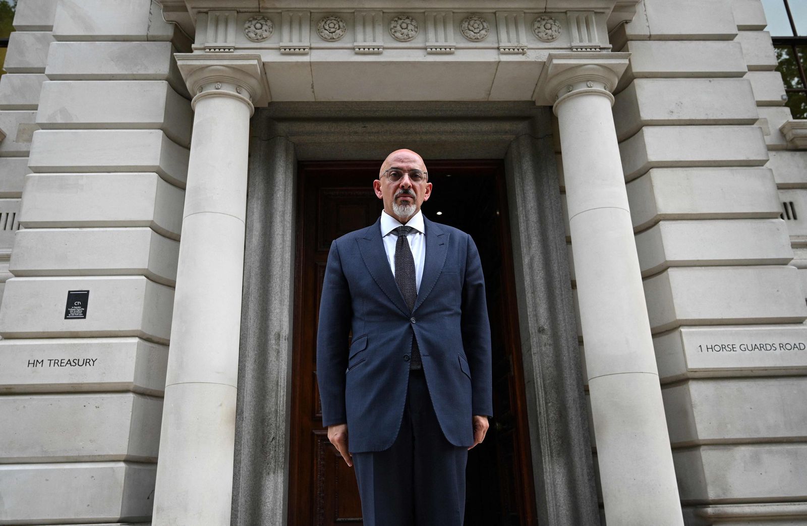 (FILES) In this file photo taken on July 6, 2022 Britain's newly appointed Chancellor of the Exchequer Nadhim Zahawi poses for a photograph as he arrives at the HM Treasury to start his new job, in central London. - Britain's Boris Johnson has announced his resignation as Conservative leader, paving the way for an internal party contest to replace him and become prime minister. While several possible successors have been suggested, there is no clear favourite. (Photo by Daniel LEAL / AFP) - AFP