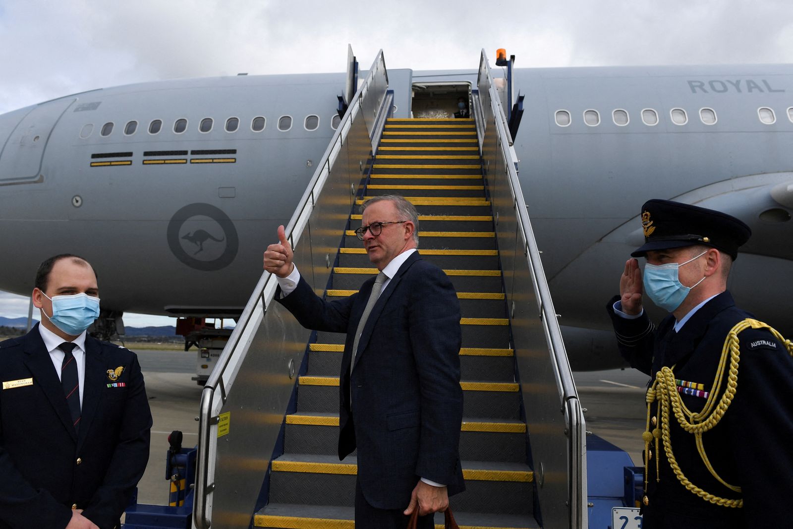 Australian Prime Minister Anthony Albanese boards the plane to Japan to attend the QUAD leaders meeting in Tokyo, in Canberra - via REUTERS