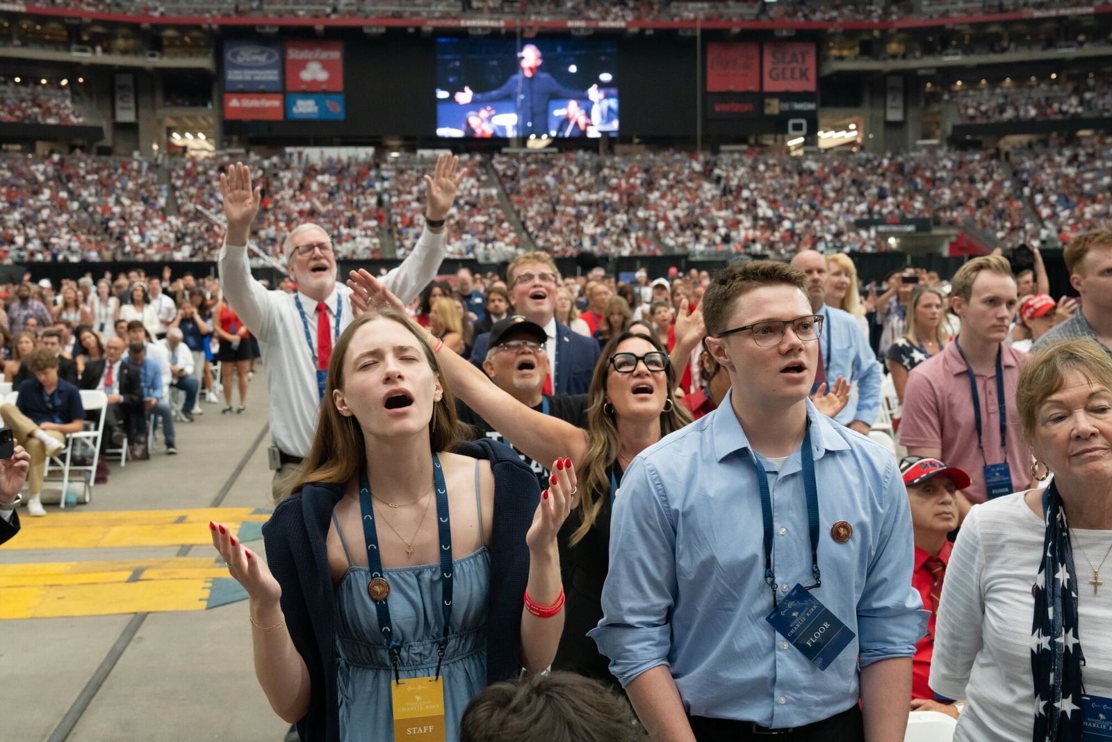 Mourners during a memorial service for Turning Point USA founder Charlie Kirk at State Farm Stadium in Glendale, Arizona, US, on Sunday, Sept. 21, 2025. President Donald Trump proclaimed Charlie Kirk a 'martyr for American freedom' in a memorial ceremony to commemorate the political activist as Erika Kirk said she forgave the man who gunned down her husband. Photographer: Rebecca Noble/Bloomberg